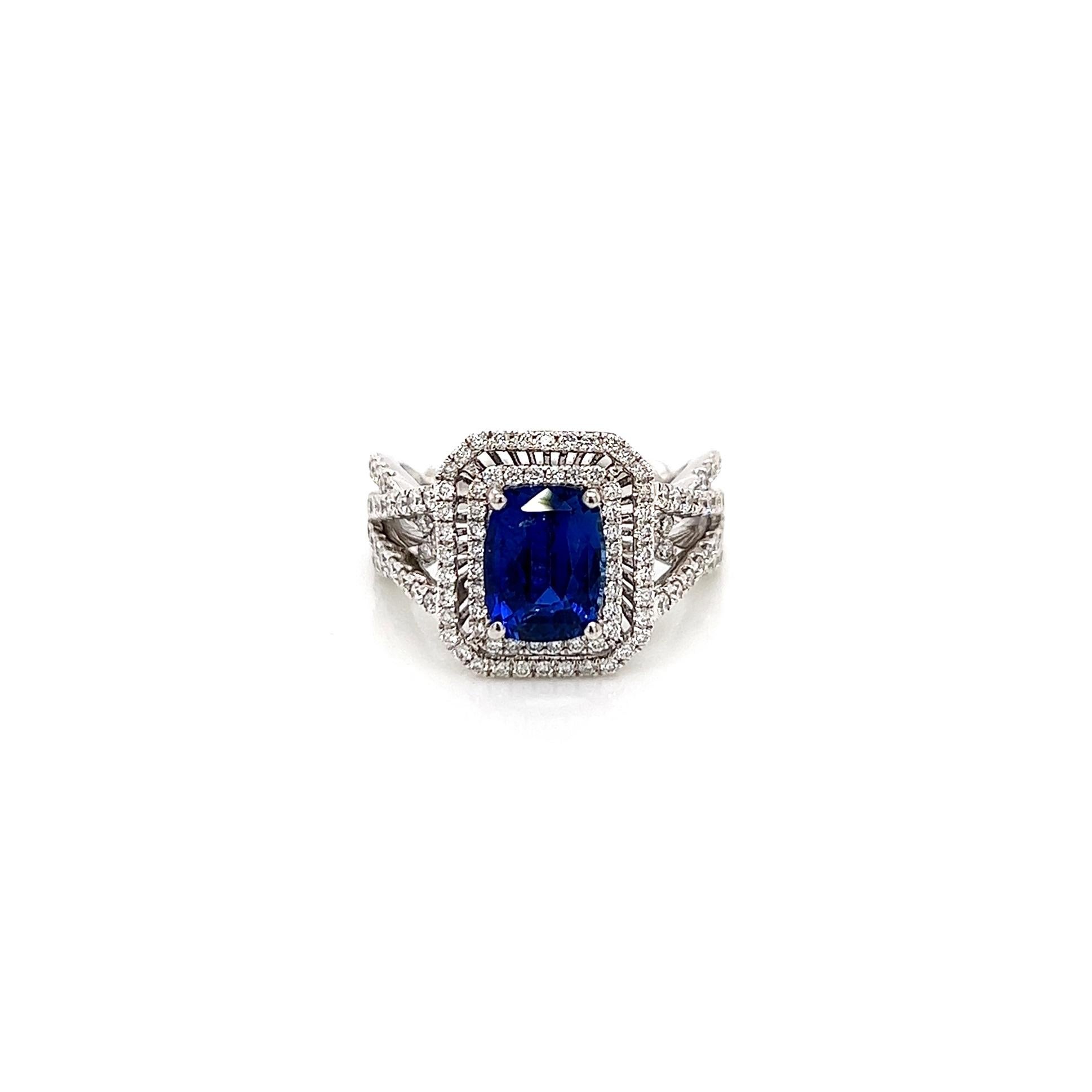 3.11 Total Carat Sapphire Diamond Engagement Ring

-Metal Type: 18K White Gold
-2.14 Carat Cushion Cut Blue Sapphire
-0.97 Carat Round Side Diamonds, F-G color, VS-SI clarity
-Size 6.25

Made in New York City.