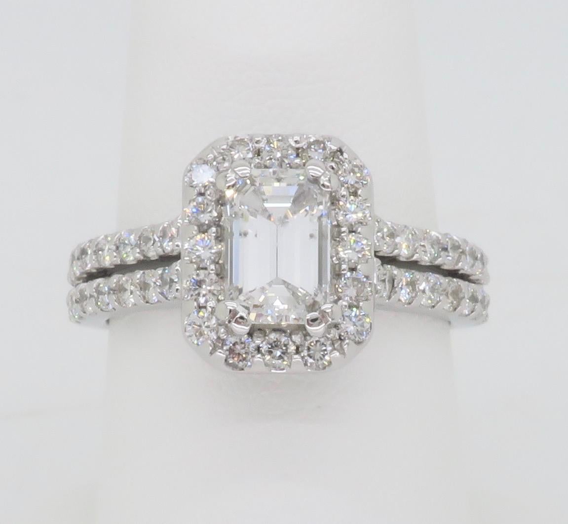 2.14CTW Diamond engagement ring with an AGS Certified Emerald Cut center diamond. 

Center Diamond Carat Weight: 1.26CT 
Center Diamond Cut: Emerald Cut 
Center Diamond Color: E
Center Diamond Clarity: SI2
Certification: AGS - 104098681010
Total