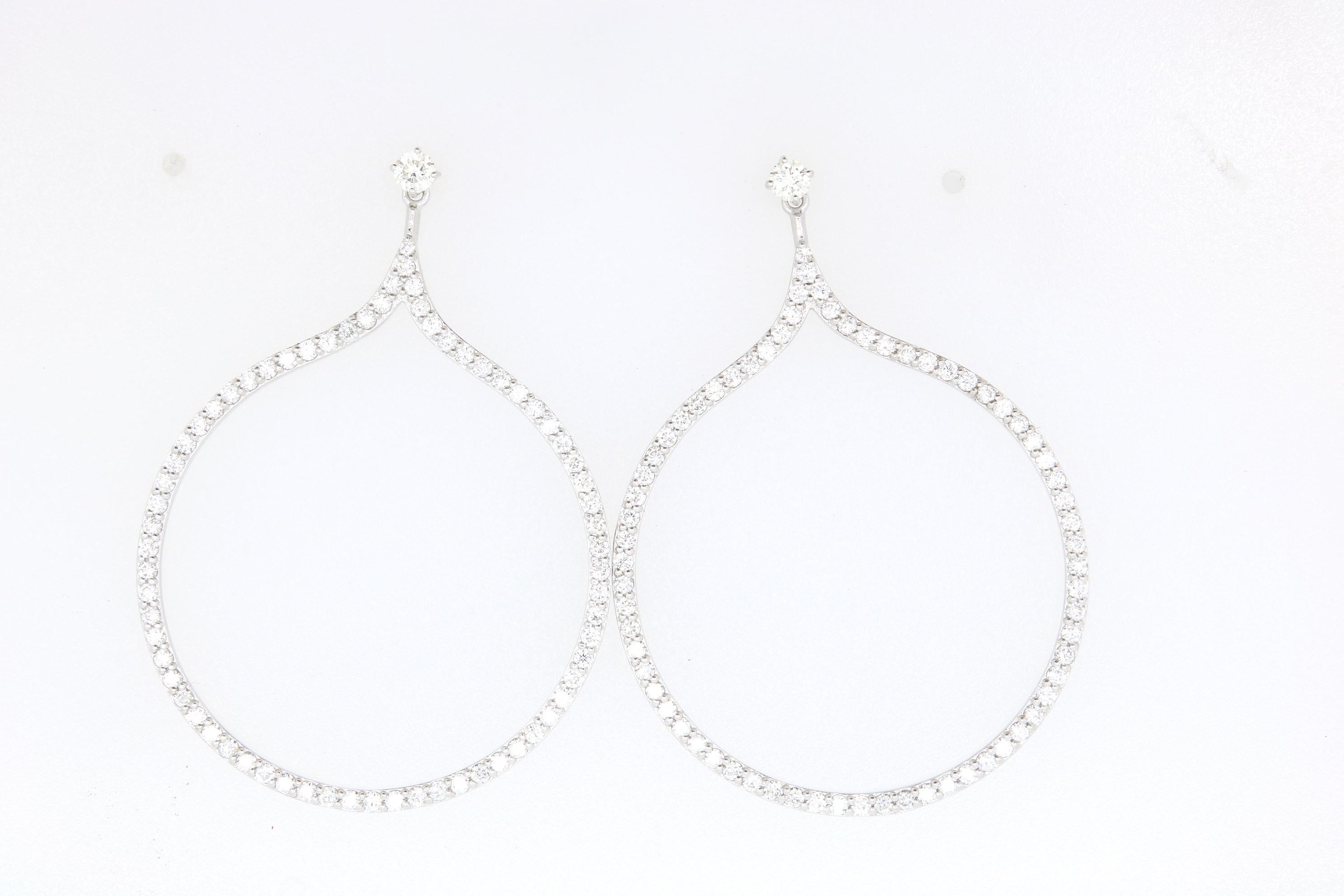 Add some sparkle to any look with these 14k White Gold hoop earrings. Featuring a 2.15 Carats of Brilliant White Diamonds, these will surely become your favorite pair of earrings! 

Material: 14k White Gold 
Mounting Stone Details: 140 Round
