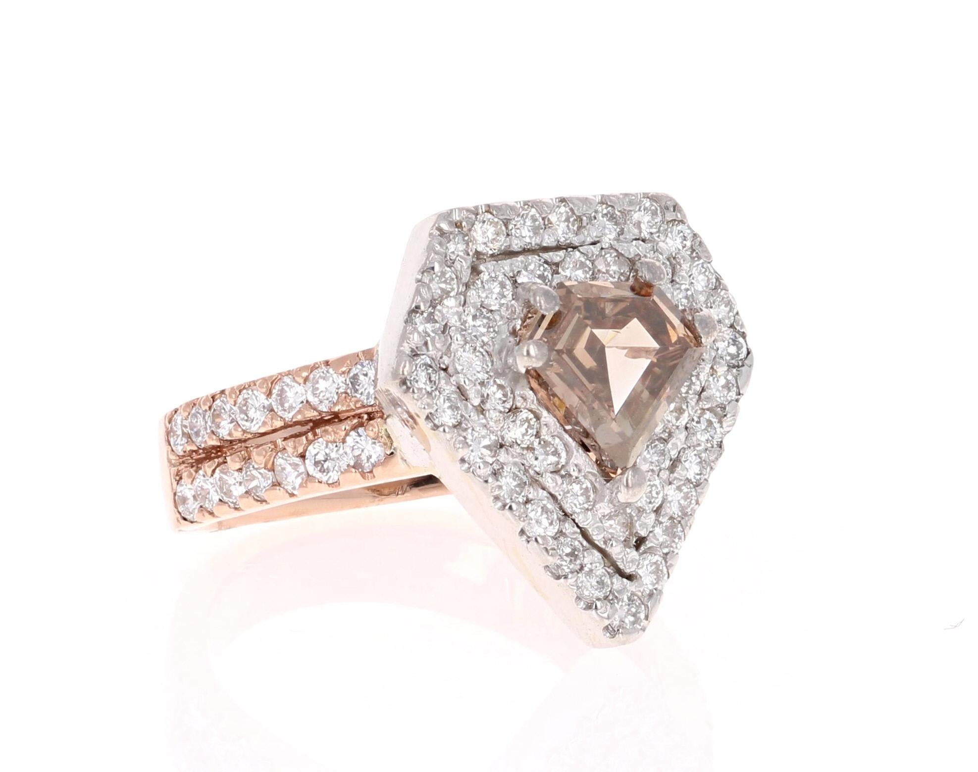 Stunning Scintillating and Unique! This two-toned diamond ring will leave a lasting impression! 

The center stone is a fancy colored Champagne Diamond Cut Diamond weighing 0.97 carats.  It is surrounded by a halo in the shape of a diamond and has