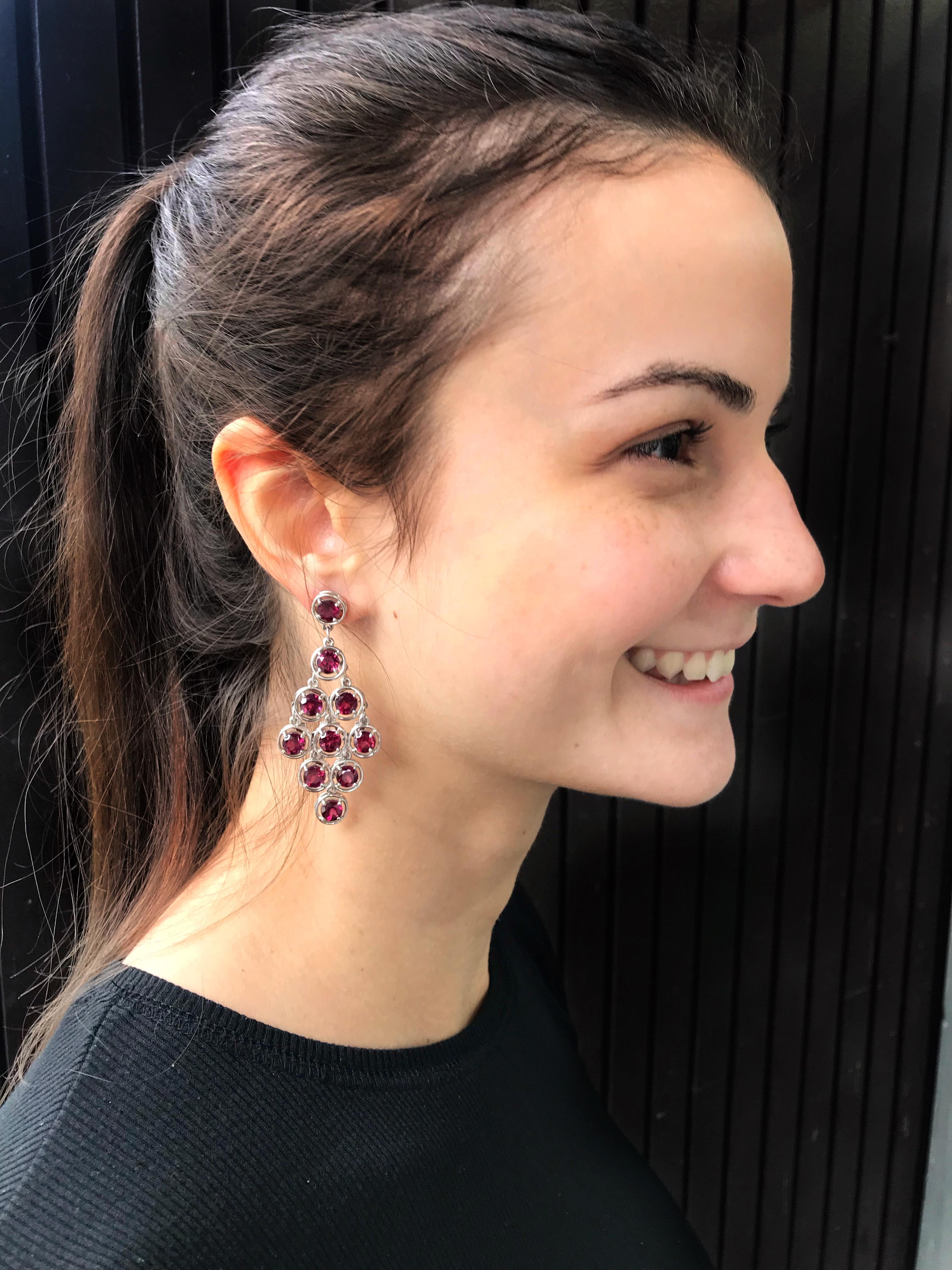 Sensational Chandelier Dangle Earrings set with twenty round faceted Garnet gemstones mounted in 14k white gold hand crafted 4-claw setting with post and butterfly closure; measuring approx. 2.5” long. A perfect complement to every wardrobe…