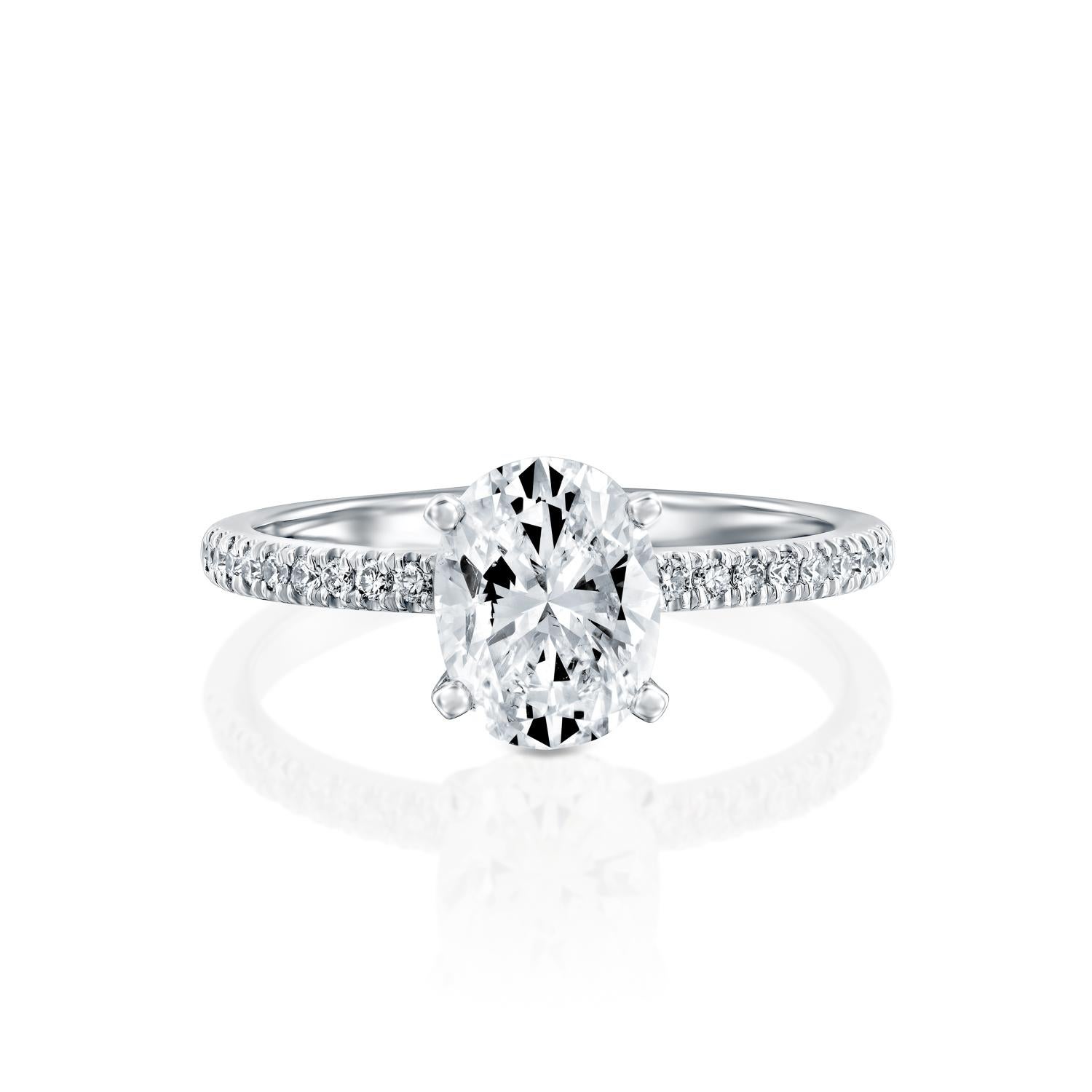 Exquisitely hand crafted ring features a solitaire GIA certified diamond. Ring features a 2 carat oval cut 100% eye clean natural diamond of F-G color and VS2-SI1 clarity and it is accented by diamonds of approx. 0.15 total carat weight. Set in a