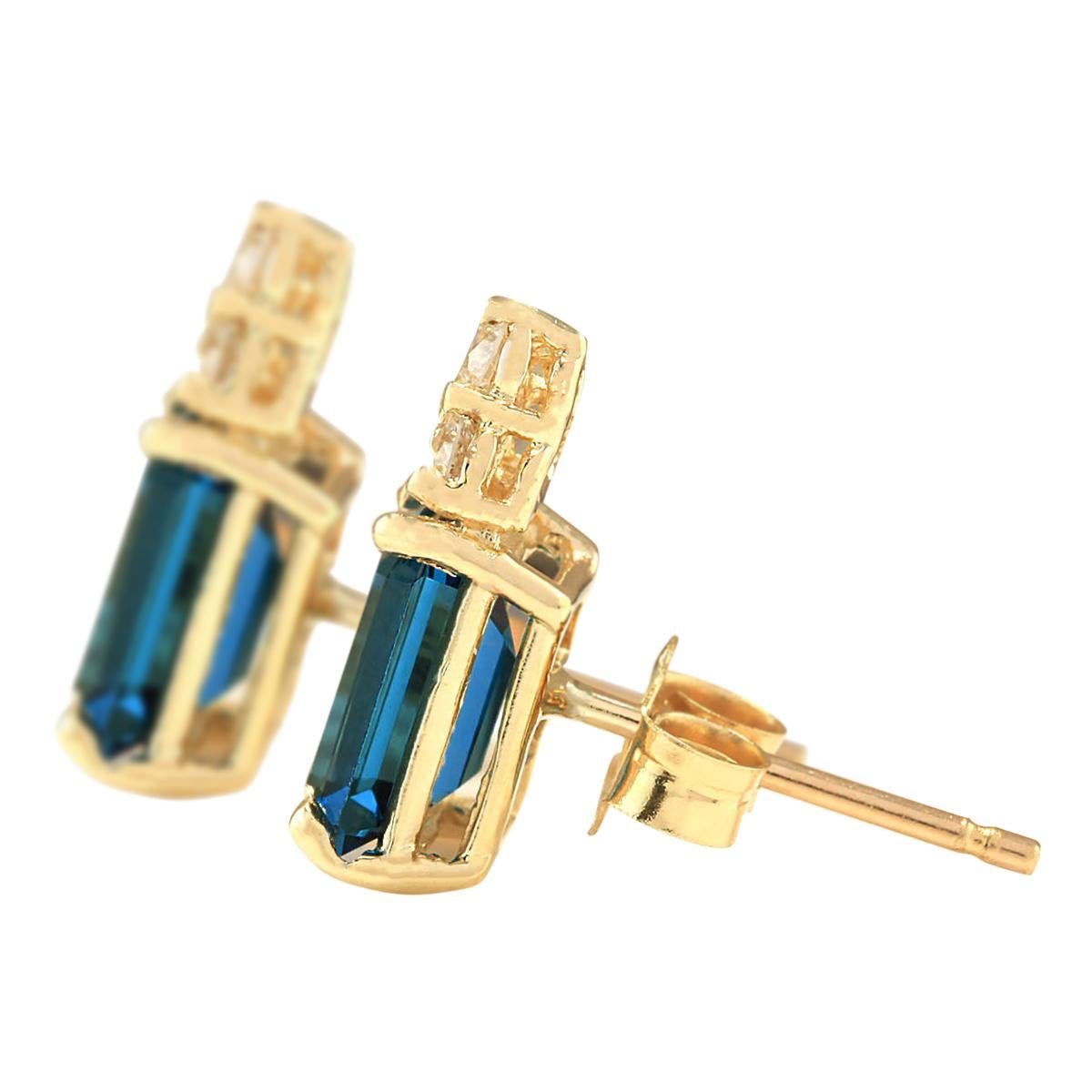 Stamped: 14K Yellow Gold
Total Earrings Weight: 1.5 Grams
Total Natural Topaz Weight is 2.00 Carat (Measures: 7.00x5.00 mm)
Color: London Blue
Total Natural Diamond Weight is 0.15 Carat
Color: F-G, Clarity: VS2-SI1
Face Measures: 11.65x4.85 mm
Sku: