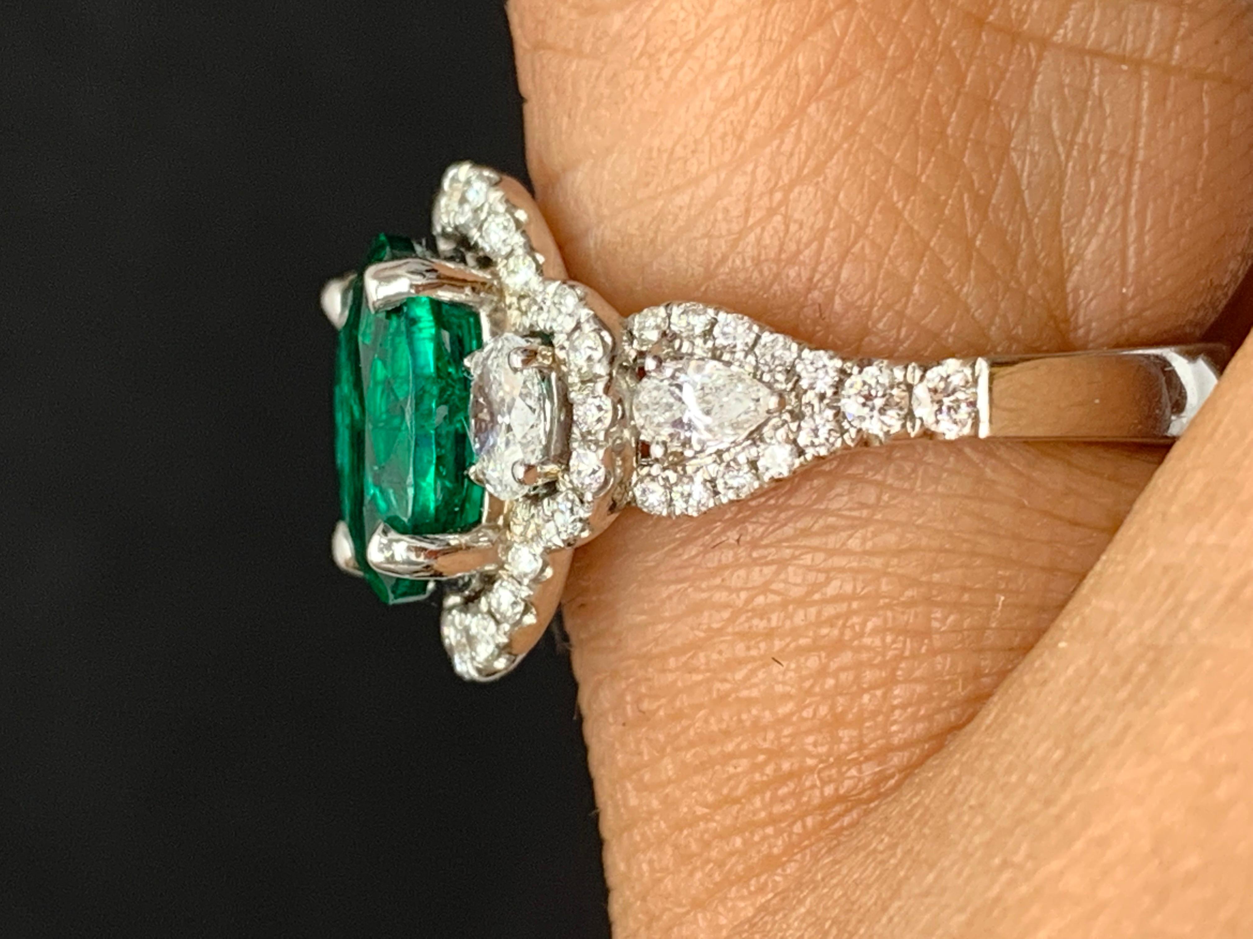 2.15 Carat Oval Cut Emerald and Diamond Halo Ring in 18K White Gold For Sale 6