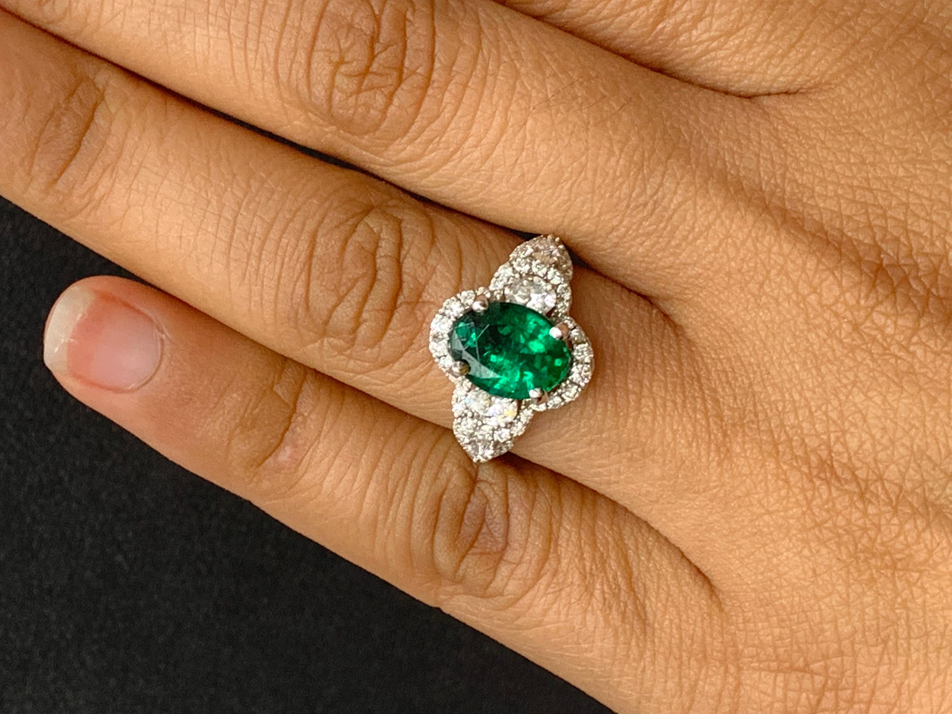 2.15 Carat Oval Cut Emerald and Diamond Halo Ring in 18K White Gold For Sale 7
