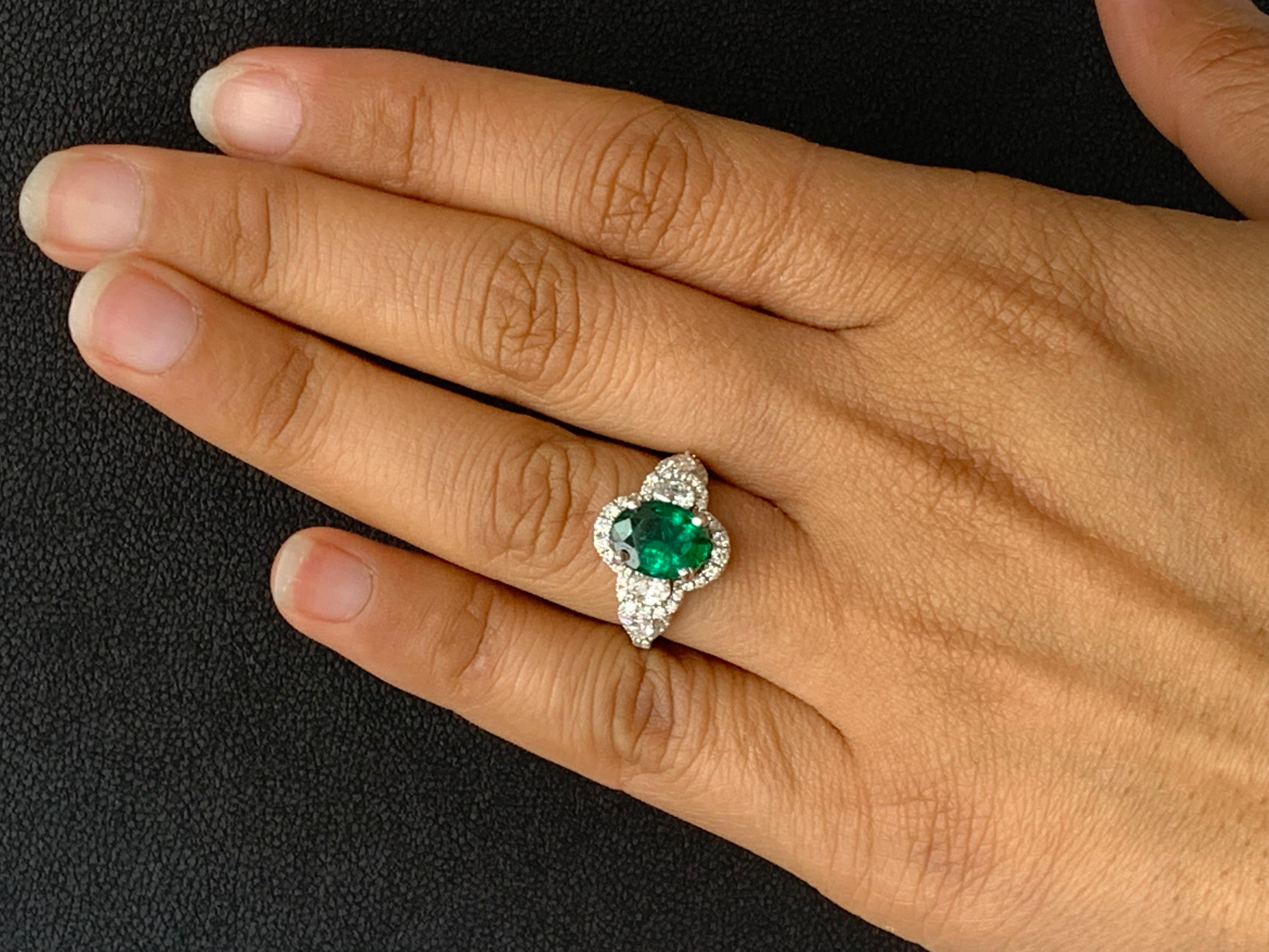 2.15 Carat Oval Cut Emerald and Diamond Halo Ring in 18K White Gold For Sale 8