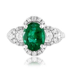 2.15 Carat Oval Cut Emerald and Diamond Halo Ring in 18K White Gold