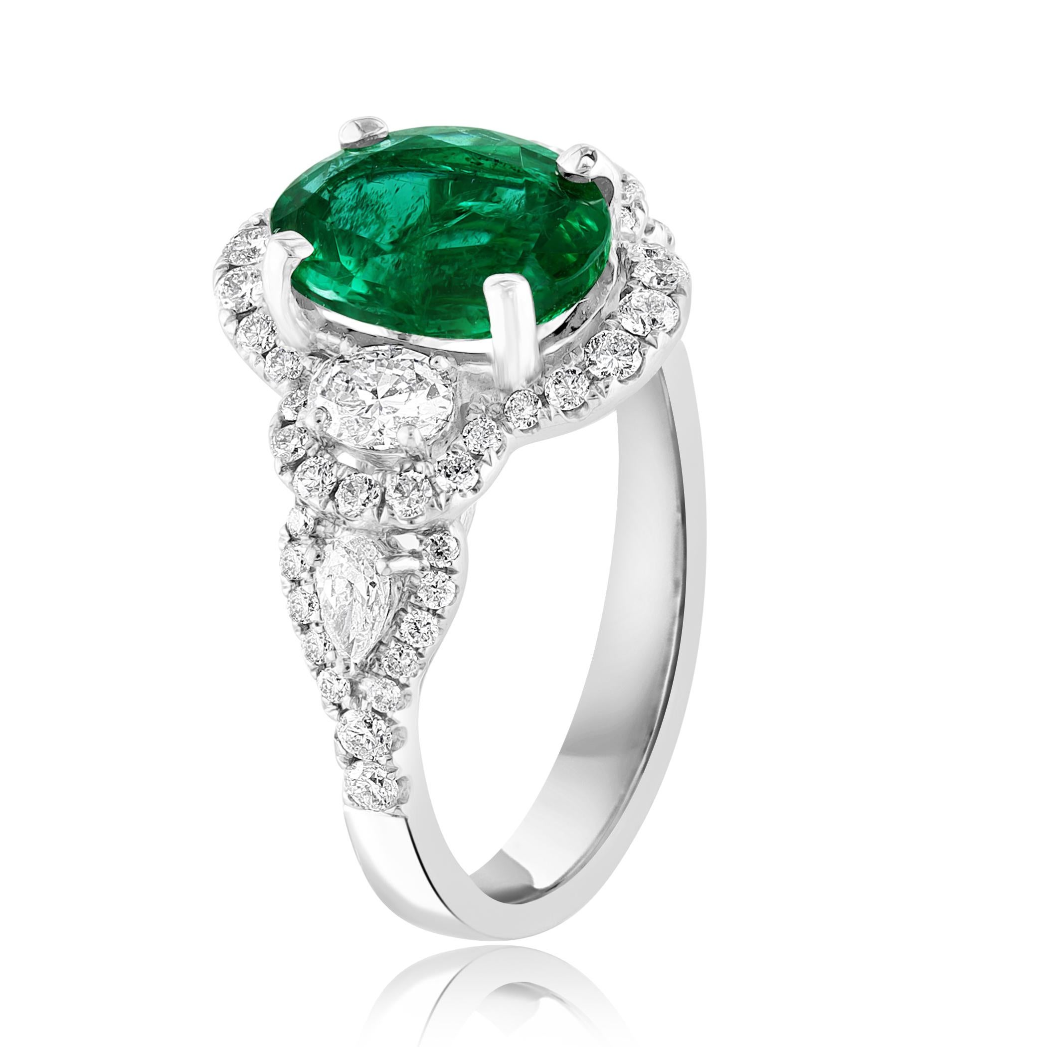 2.15 Carat Oval Cut Emerald and Diamond Halo Ring in 18K White Gold In New Condition For Sale In NEW YORK, NY