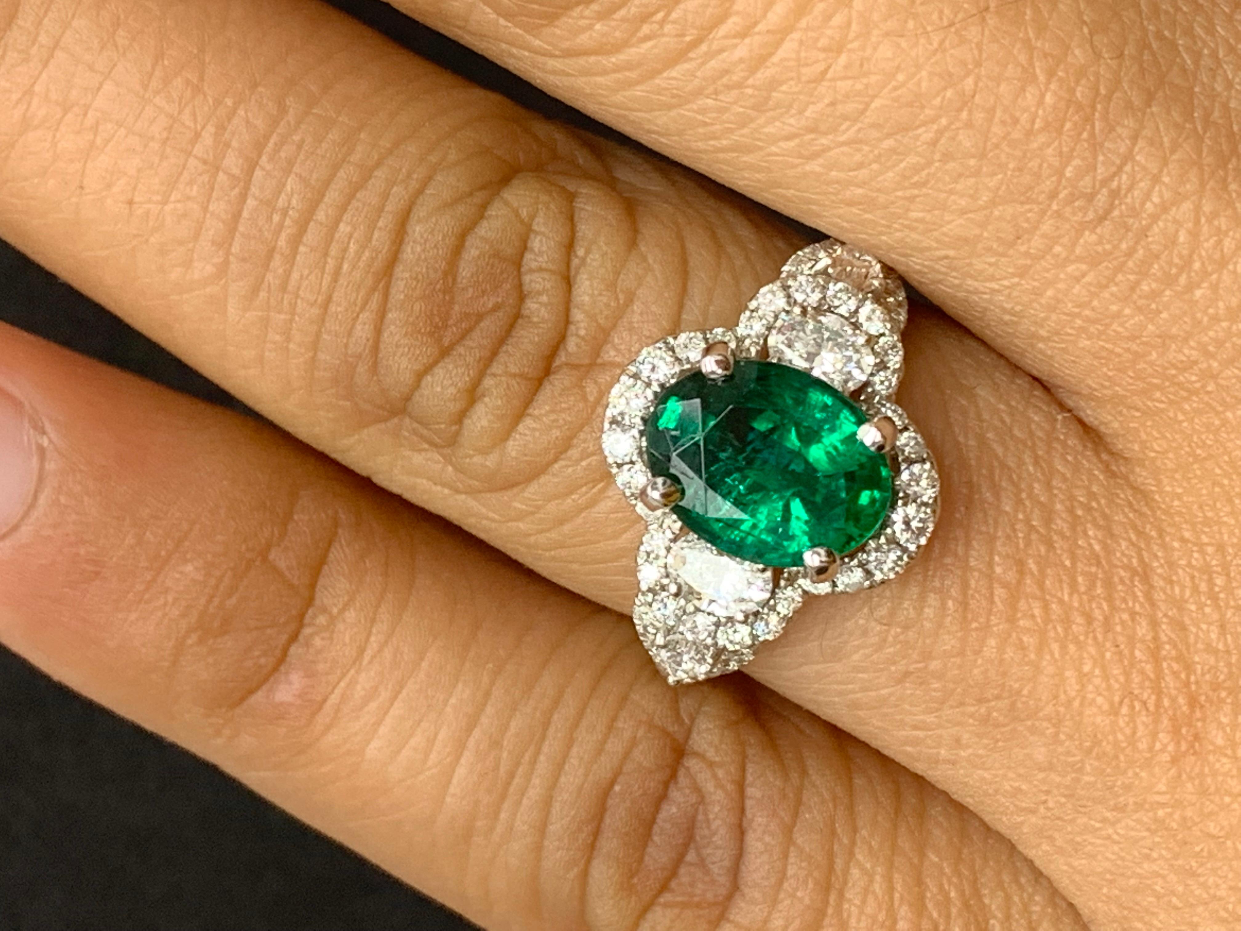 Women's 2.15 Carat Oval Cut Emerald and Diamond Halo Ring in 18K White Gold For Sale