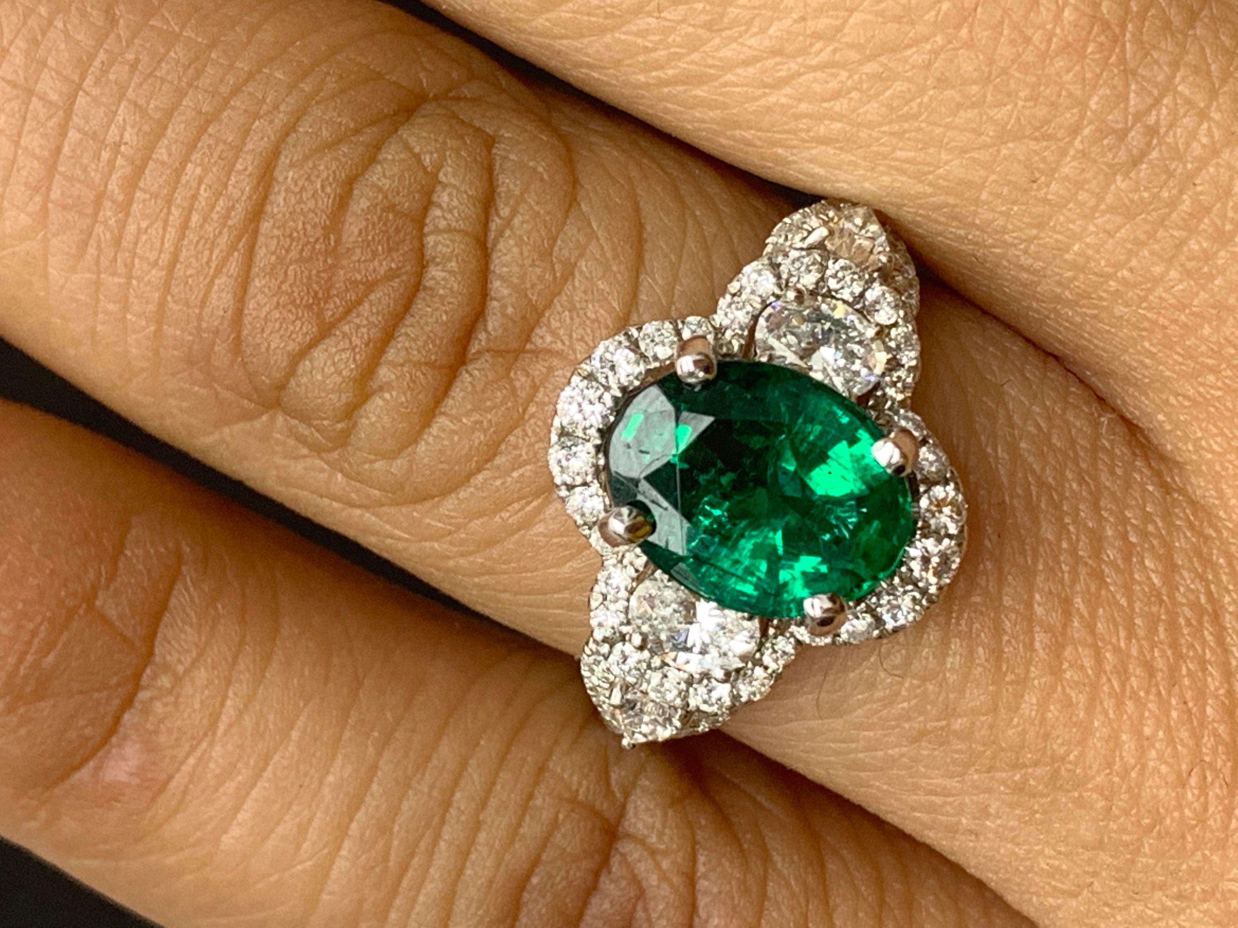 2.15 Carat Oval Cut Emerald and Diamond Halo Ring in 18K White Gold For Sale 1