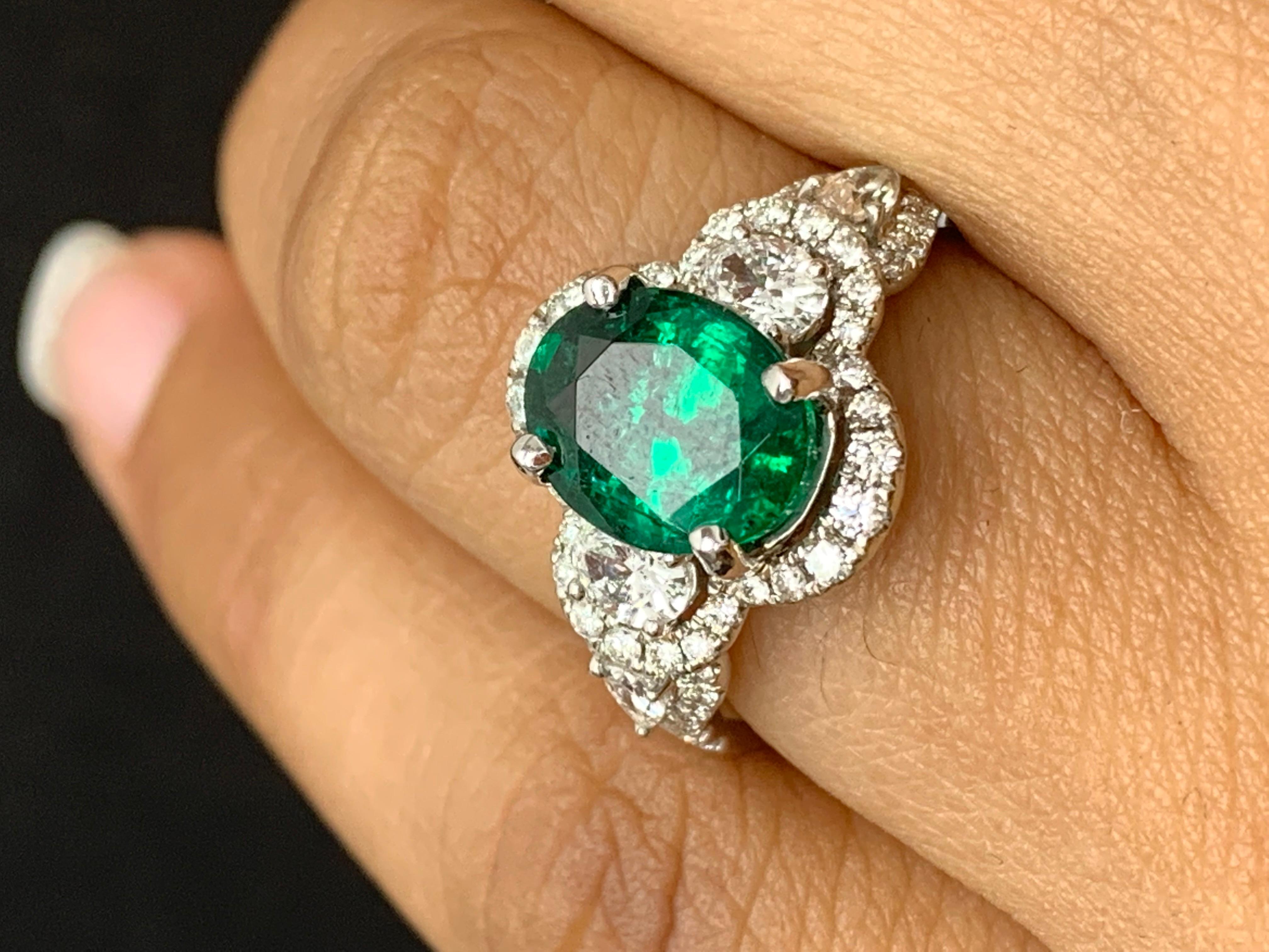 2.15 Carat Oval Cut Emerald and Diamond Halo Ring in 18K White Gold For Sale 2