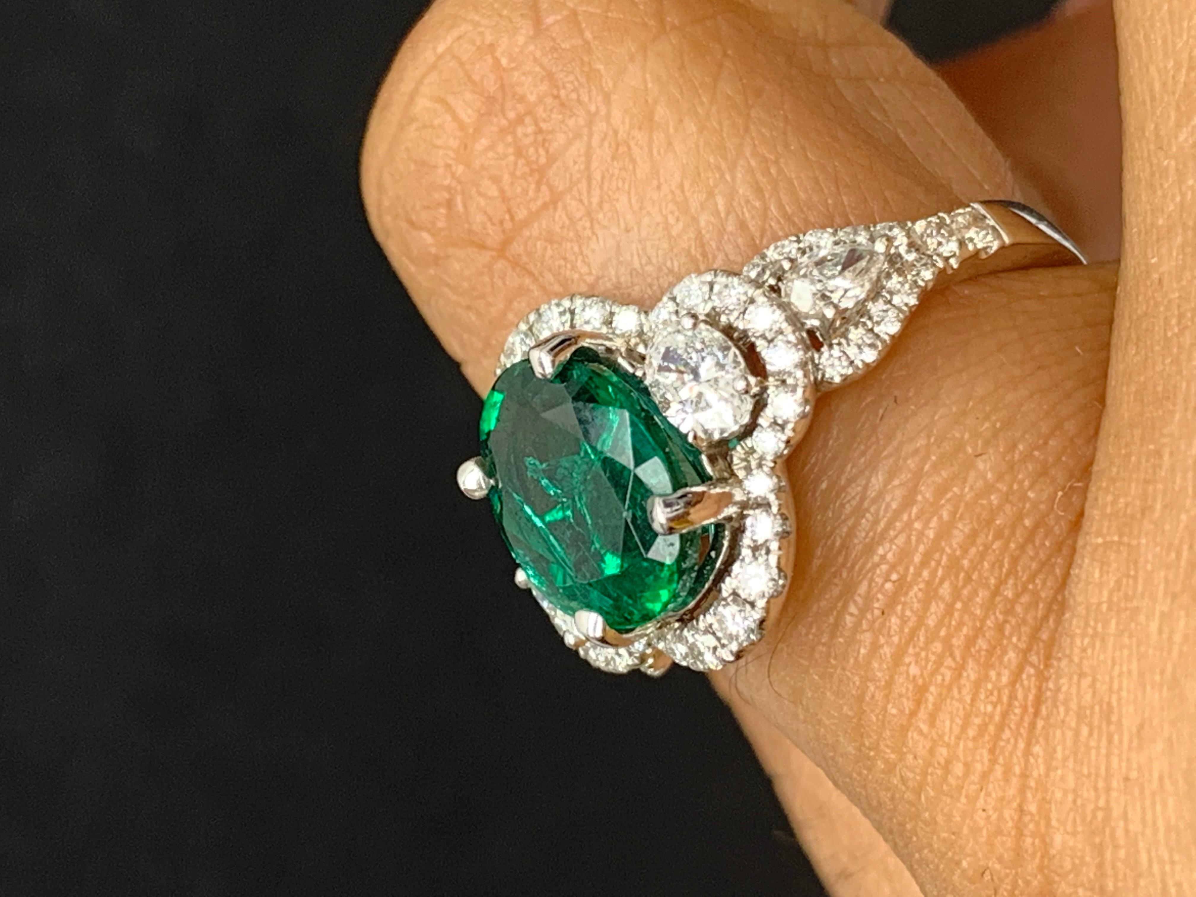 2.15 Carat Oval Cut Emerald and Diamond Halo Ring in 18K White Gold For Sale 3