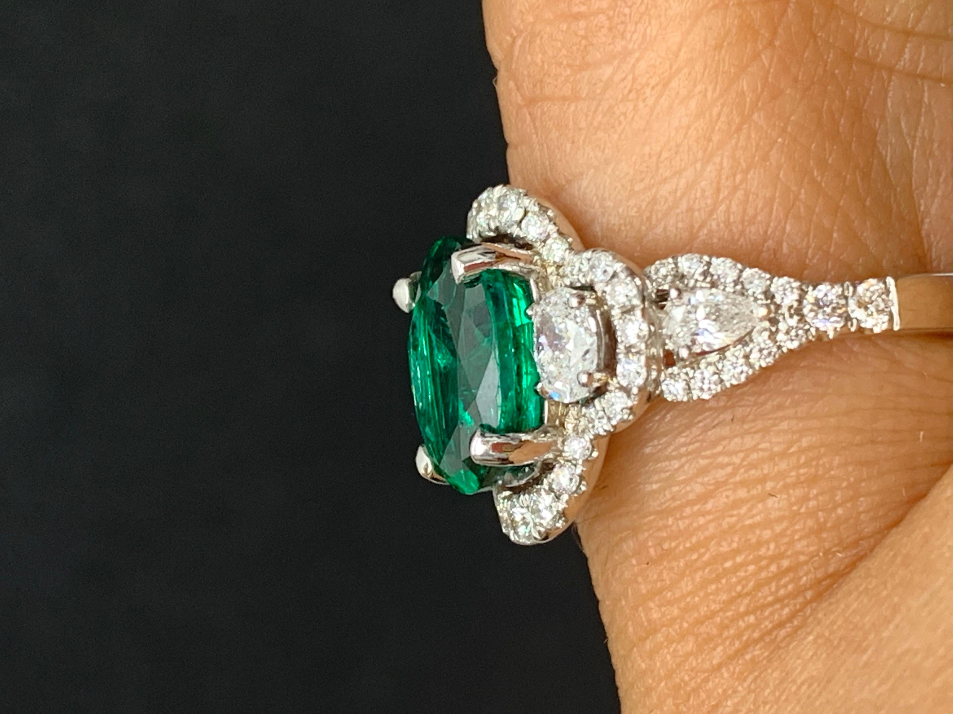2.15 Carat Oval Cut Emerald and Diamond Halo Ring in 18K White Gold For Sale 4