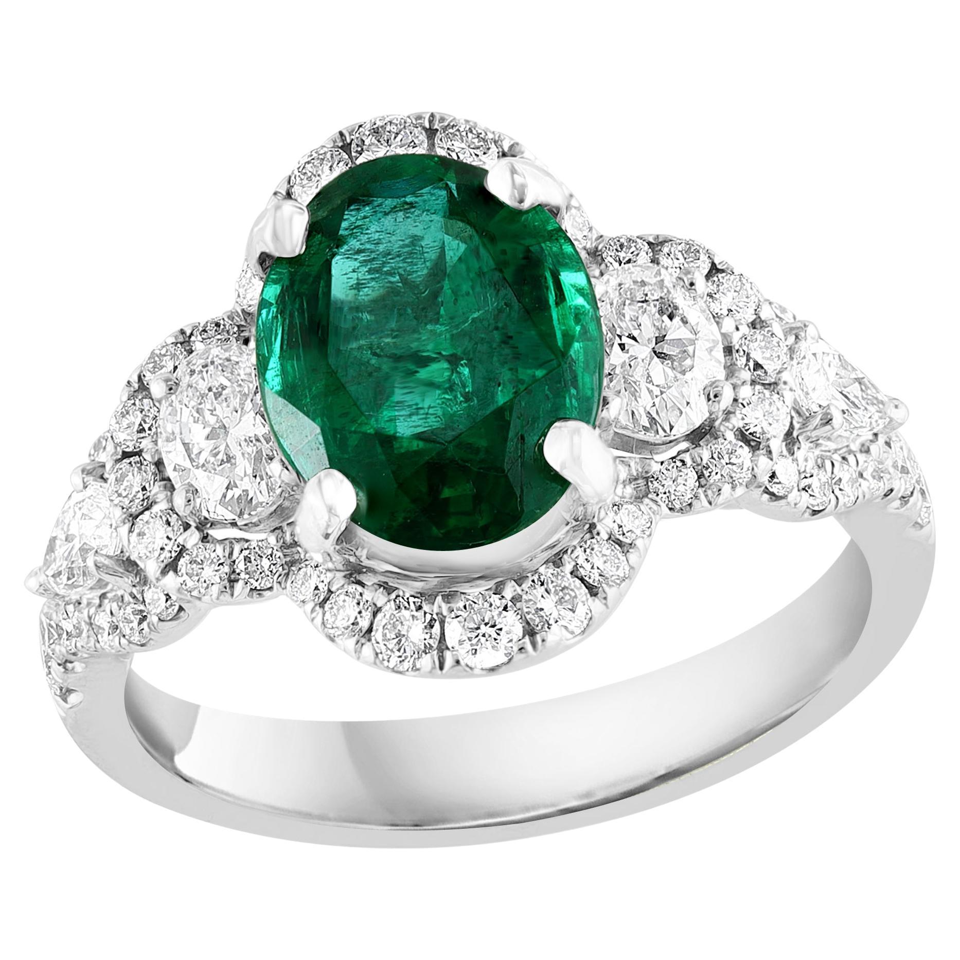 2.15 Carat Oval Cut Emerald and Diamond Halo Ring in 18K White Gold For Sale