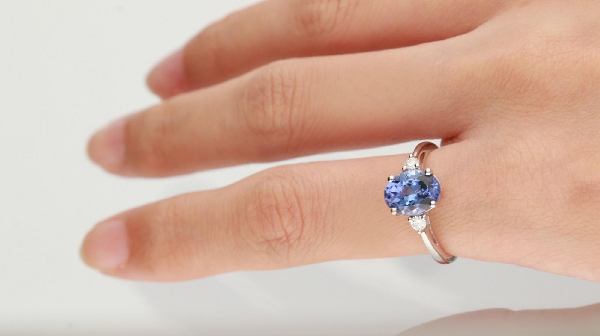 Stunning, timeless and classy eternity Unique Ring. Decorate yourself in luxury with this Gin & Grace Ring. The 14k White Gold jewelry boasts Oval-Cut Prong Setting Genuine Tanzanite (1 pcs) 2.15 Carat, along with Natural Round cut white Diamond (2