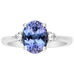 Anello di fidanzamento in oro bianco 14K con accenti di diamanti di 2,15 carati e taglio ovale di tanzanite