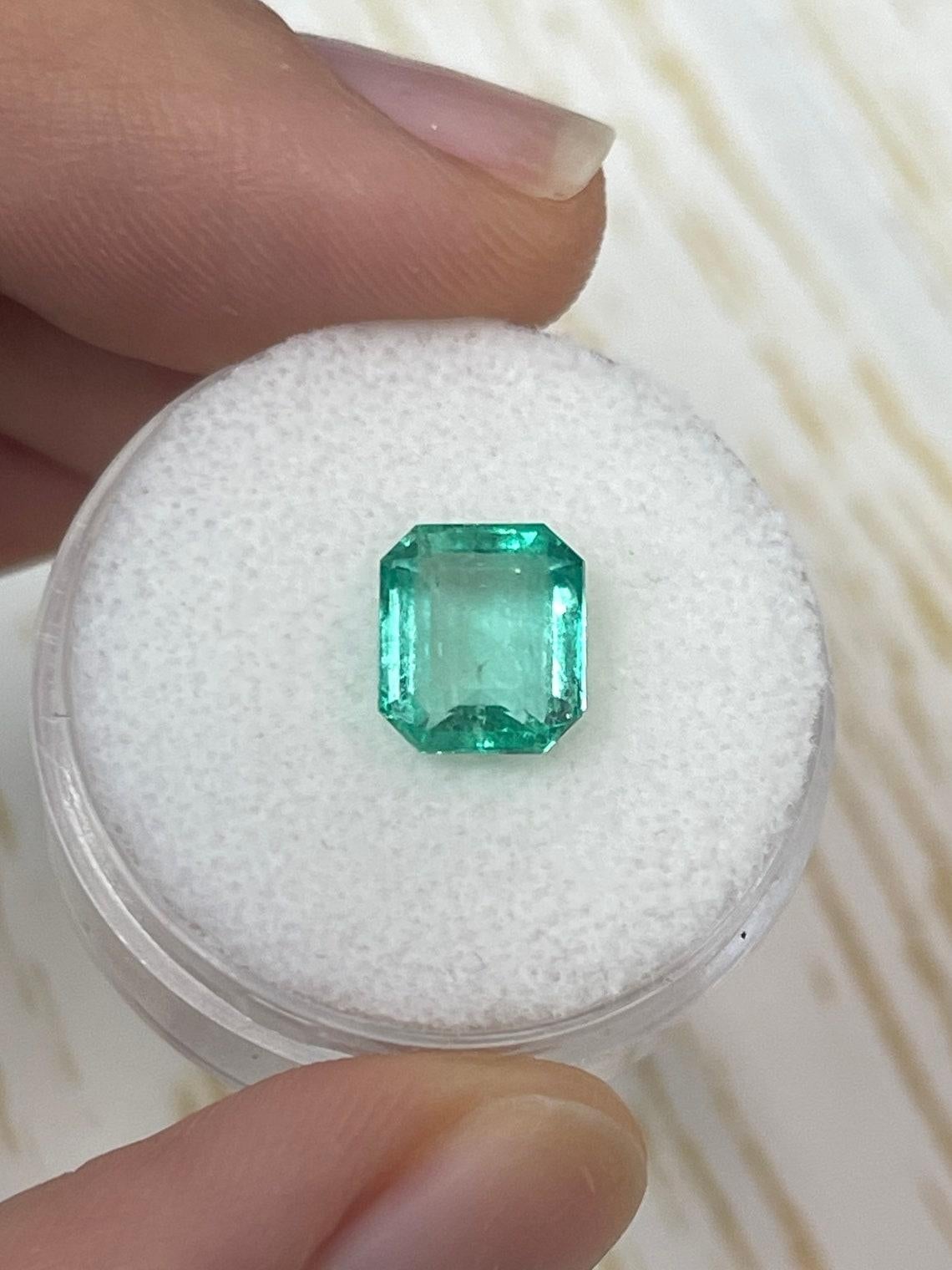 Stone: Emerald
Weight: 2.15-carats
Shape: Emerald Cut
Clarity: Transparent
Luster: Very Good
Color: Medium Bluish Green
Measurements: 8.52mm x 7.49mm x 4.53mm
Geographic Origin: Colombia
Treatment: Natural, Oiling

Comments: Due to their growth
