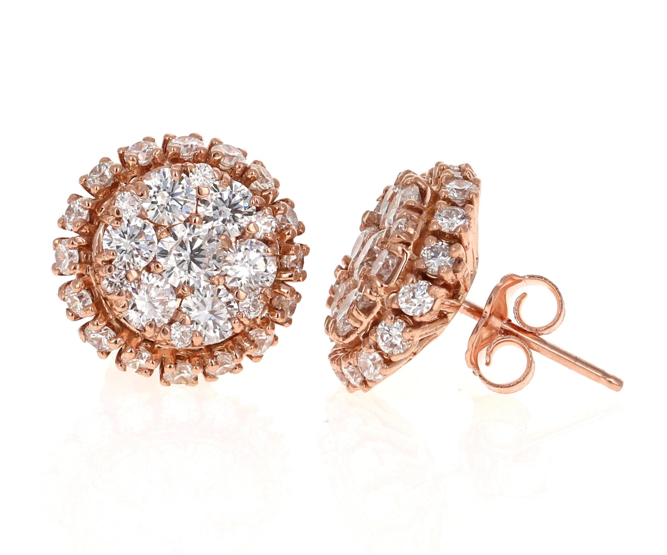 2.15 Carat Round Cut Diamond Floret-style Cluster Earrings in 14 Karat Rose Gold

These unique & intricate design earrings are sure to make a stunning statement!  There are 58 Round Brilliant Cut Diamonds that weigh 2.15 Carats.  The cluster style