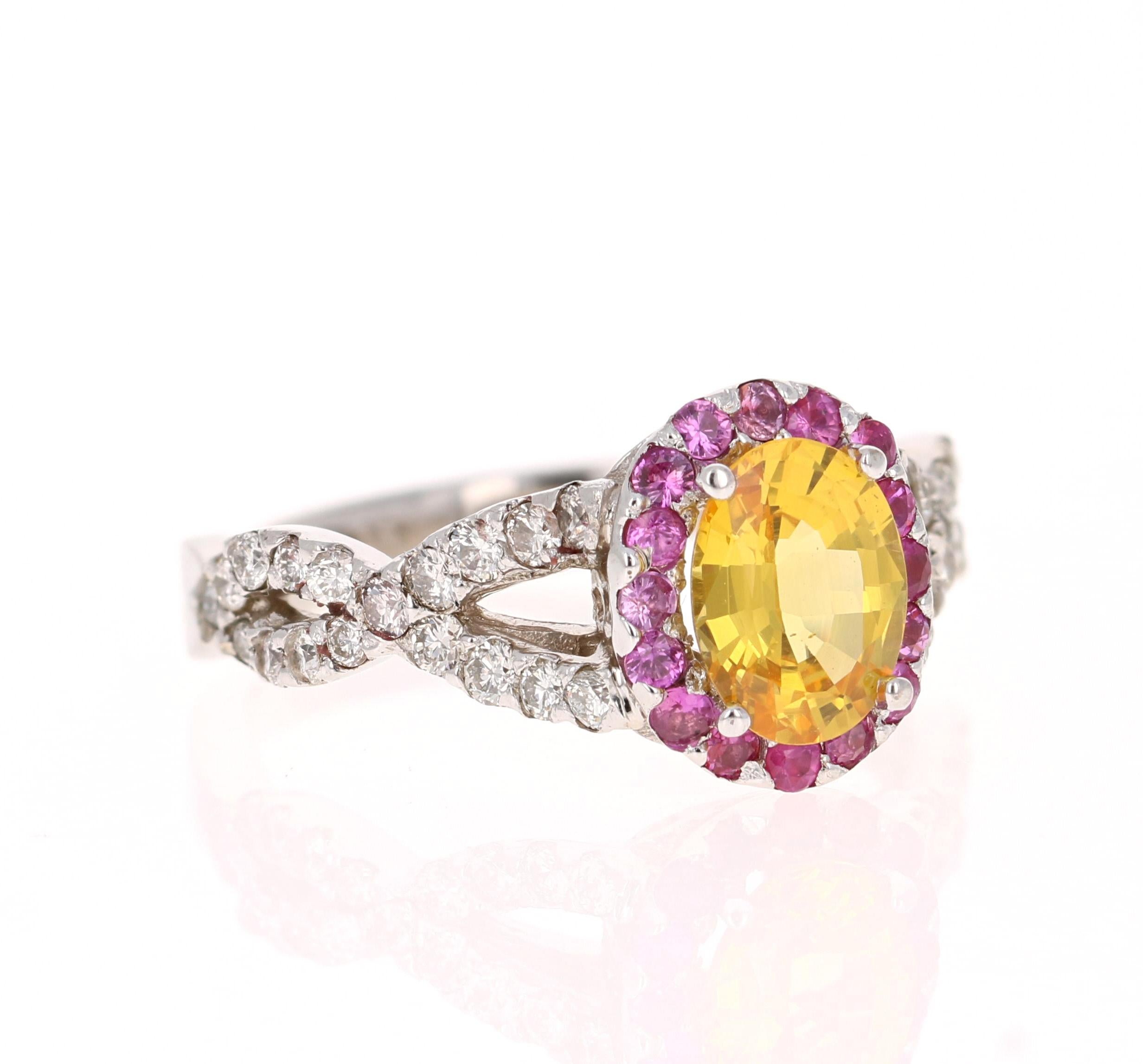 This ring has a 1.28 Carat Oval Cut Natural Yellow Sapphire. 
It has a halo of 17 Pink Sapphires that weigh 0.29 carats (Clarity: SI, Color: F) and 36 Round Cut Diamonds that weigh 0.58 Carats. The total carat weight of the ring is 2.15 Carats. 

It