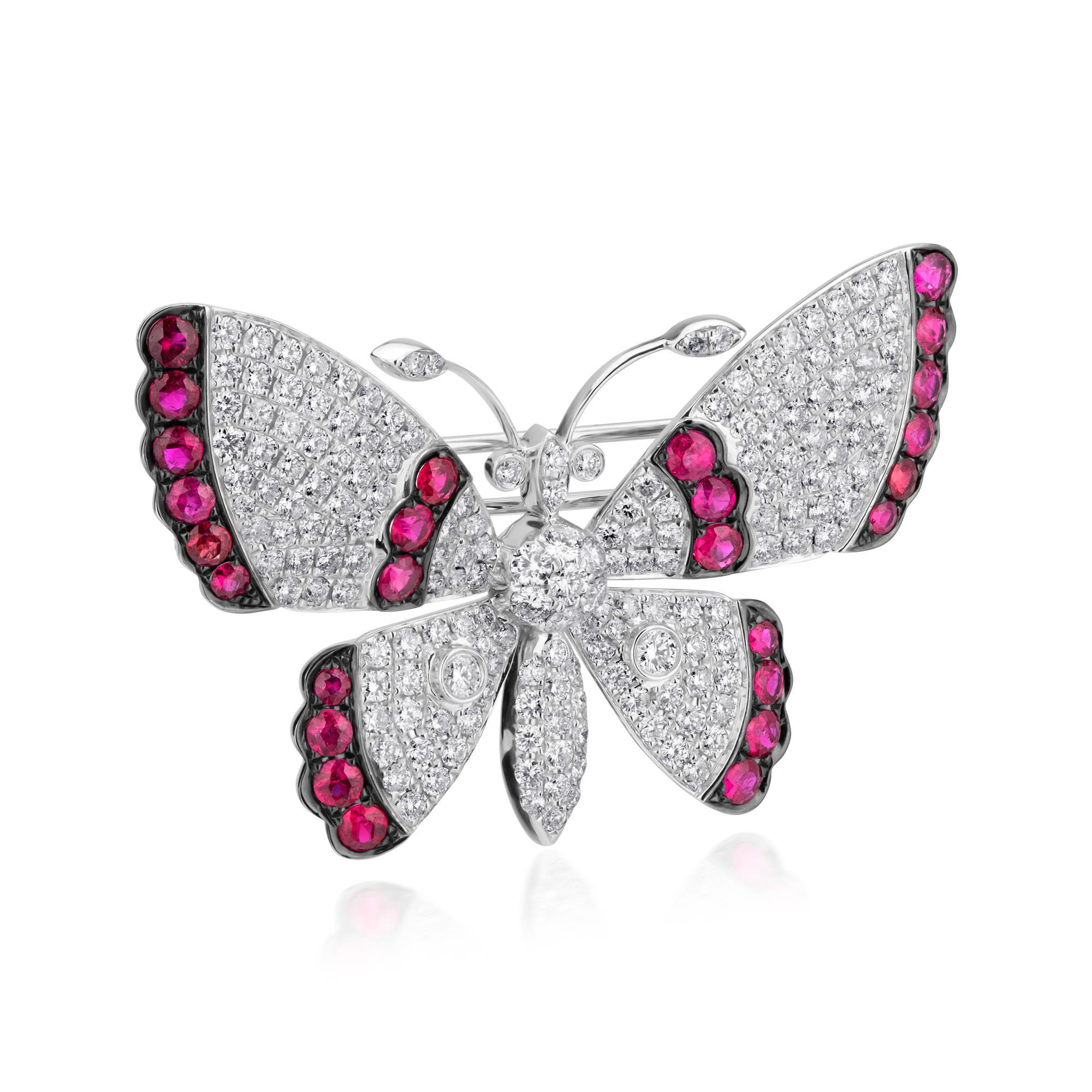 A gorgeous butterfly in – flight shows off its sparkly wings. The beautiful brooch comes to life with 2.15 ct. t.w. round brilliant cut diamonds and 1.45 ct. t.w. rubies in black rhodium. Set in polished 18k white gold. Push-Pull safety. Ruby and