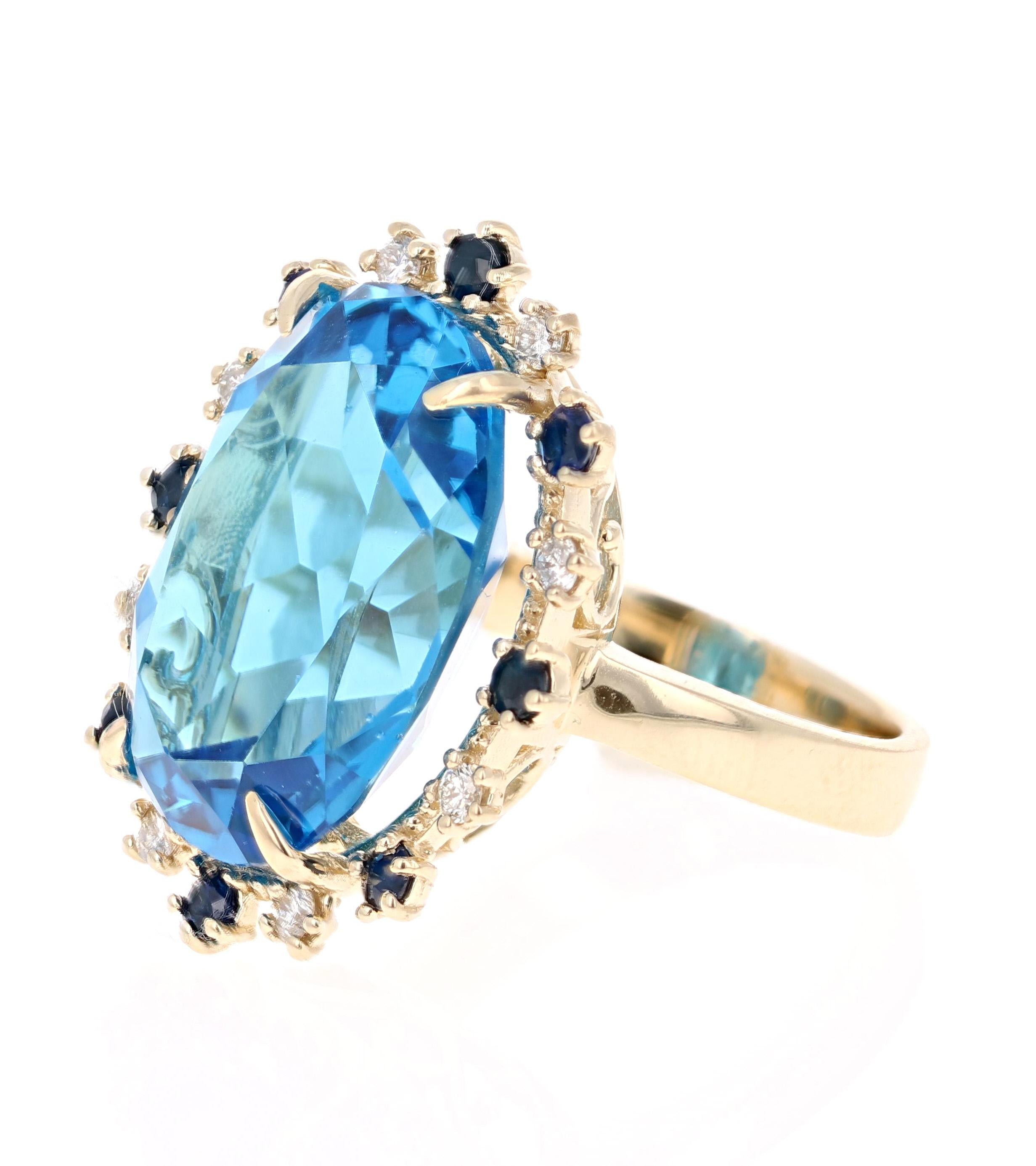 Contemporary 21.50 Carat Blue Topaz Diamond Yellow Gold Cocktail Ring For Sale
