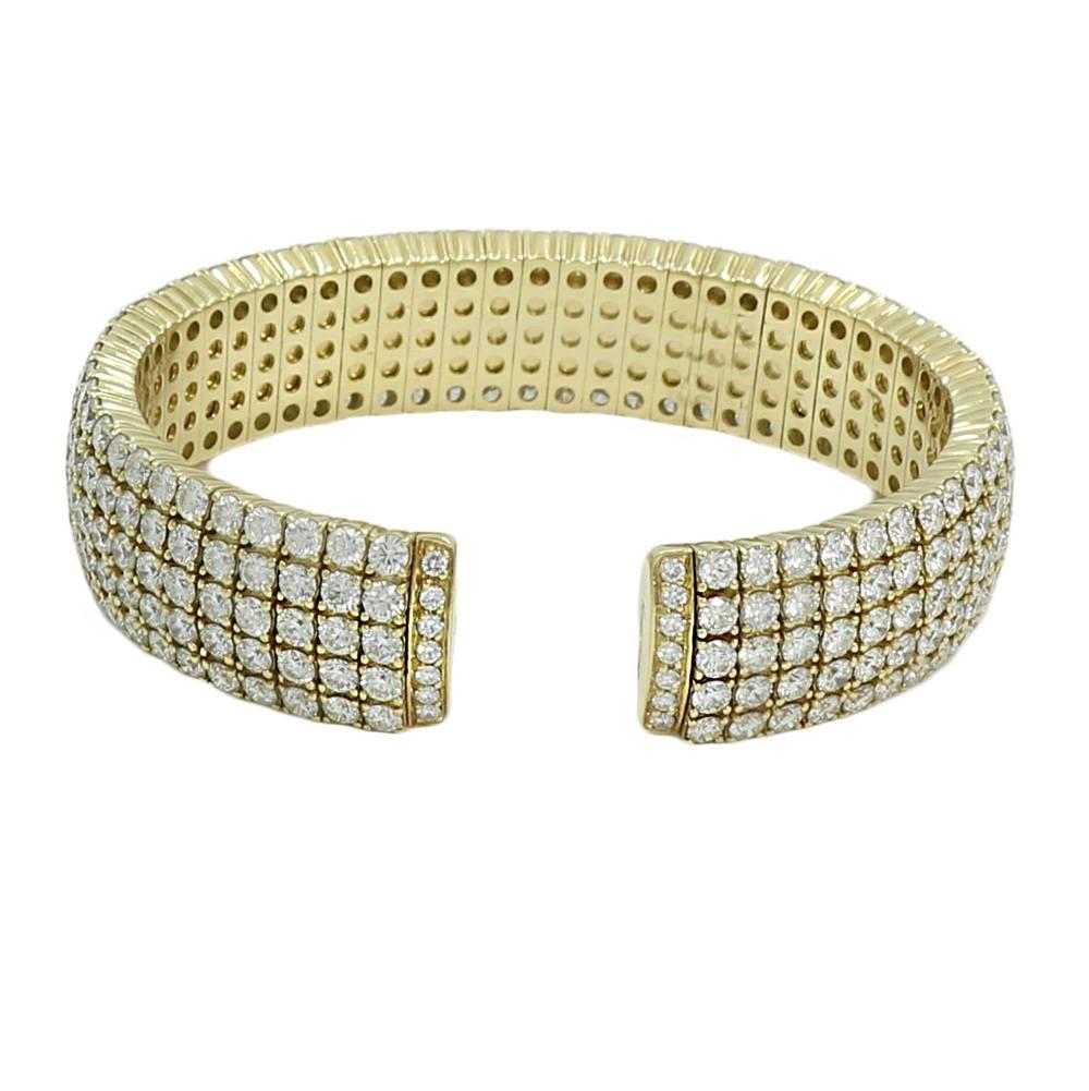 18K Yellow Gold Diamond Cuff with 5 Rows of Pave Diamonds. It Has 299 Round Brilliant Cut Diamonds Weighing 21.50 Carats Total Weight. The Cuff Measures 2.5 Inches In Width and Weighs A Total Of 87.7 Grams. 