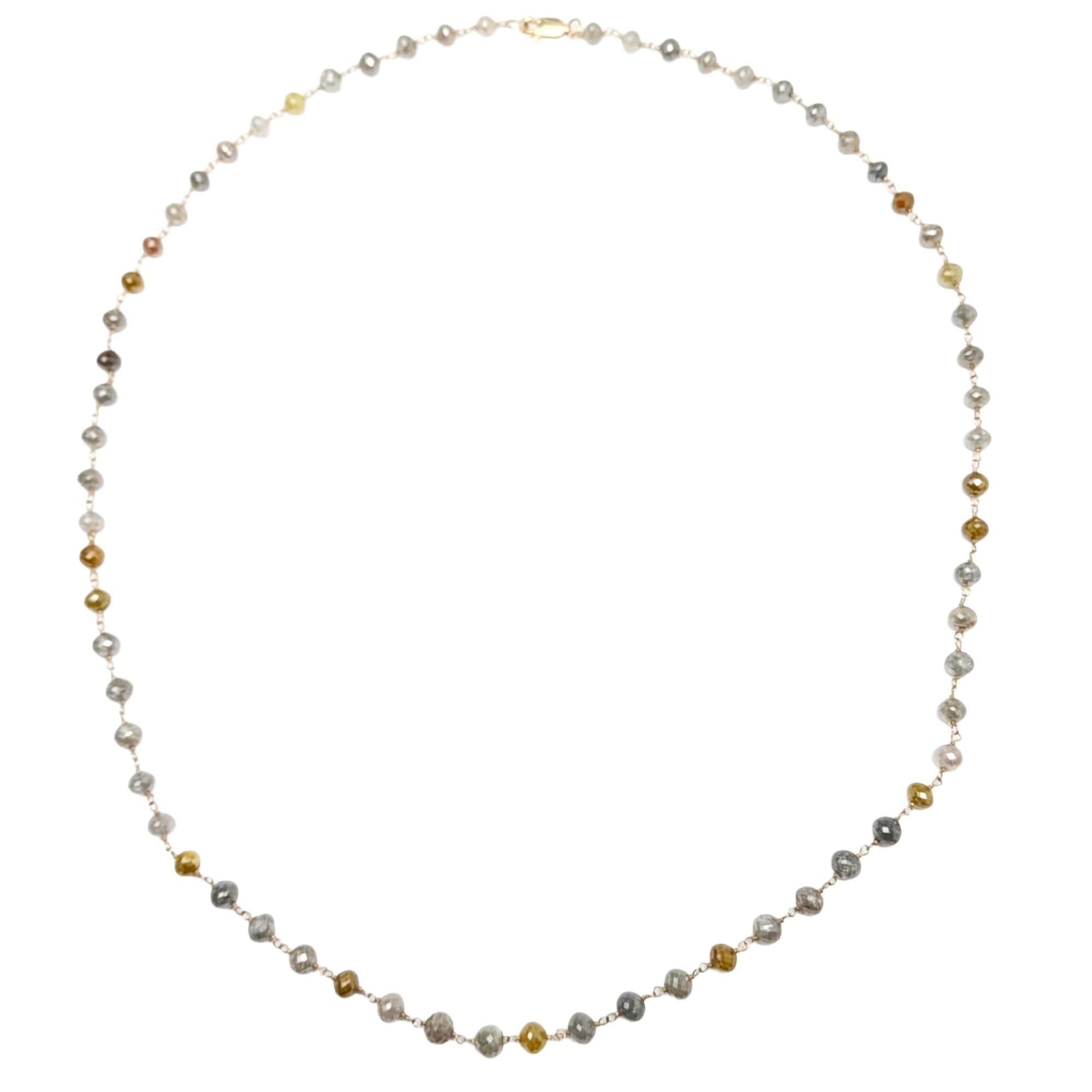Vibrant, luxurious, and meticulously crafted, this 21.5-inch rosary necklace showcases a stunning spectrum of natural diamond beads ranging from yellow to grey, brown, and warm orange hues. Each diamond is individually hand-linked with 14K yellow