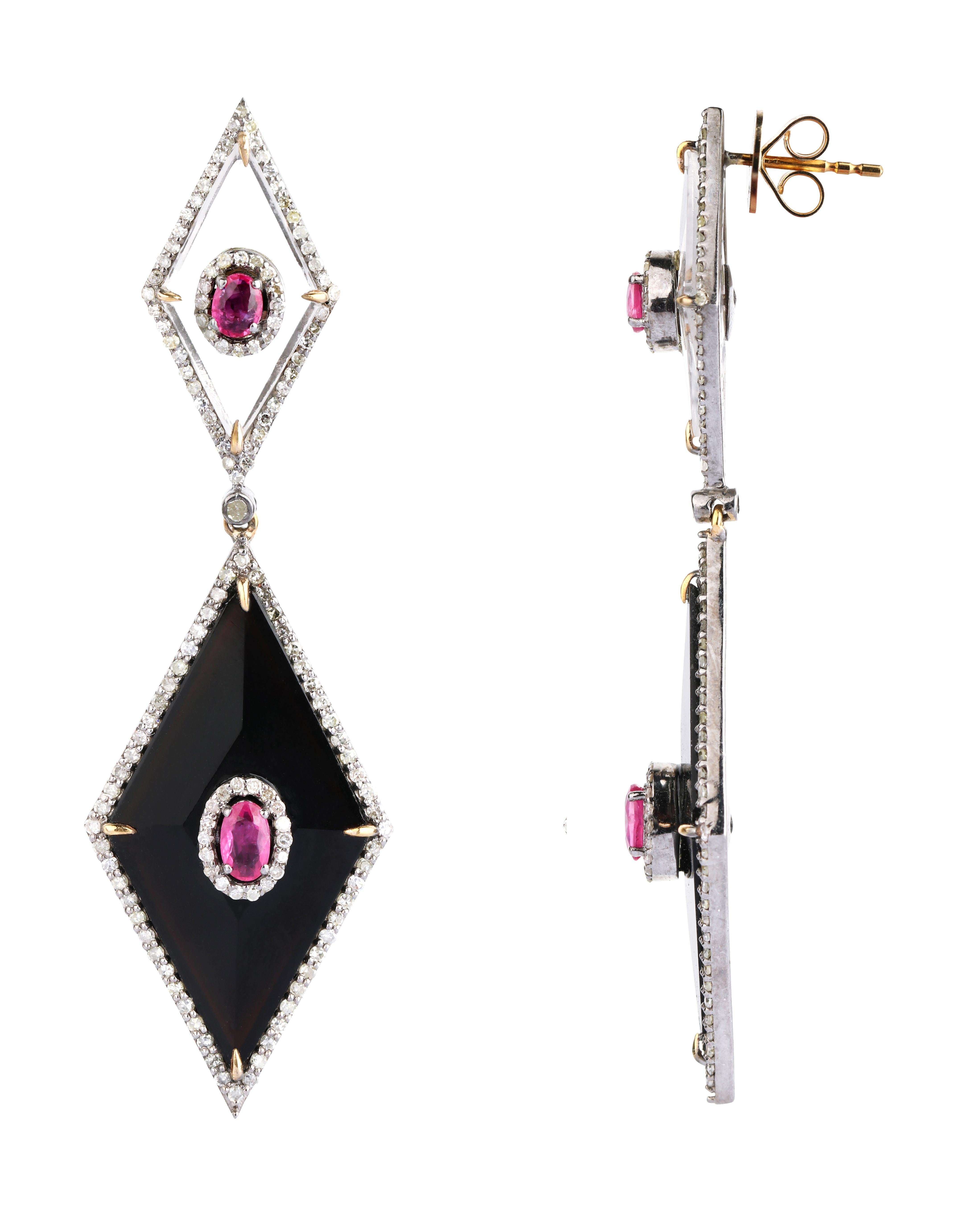 21.52 Carat Ruby, Diamond, Onyx, and Crystal Dangle Earring in Modern Style 

Passion and expertise come together in this intricate earring set embellished with diamonds, crystal, onyx, and ruby in elegant and artistic patterns. This set of earrings