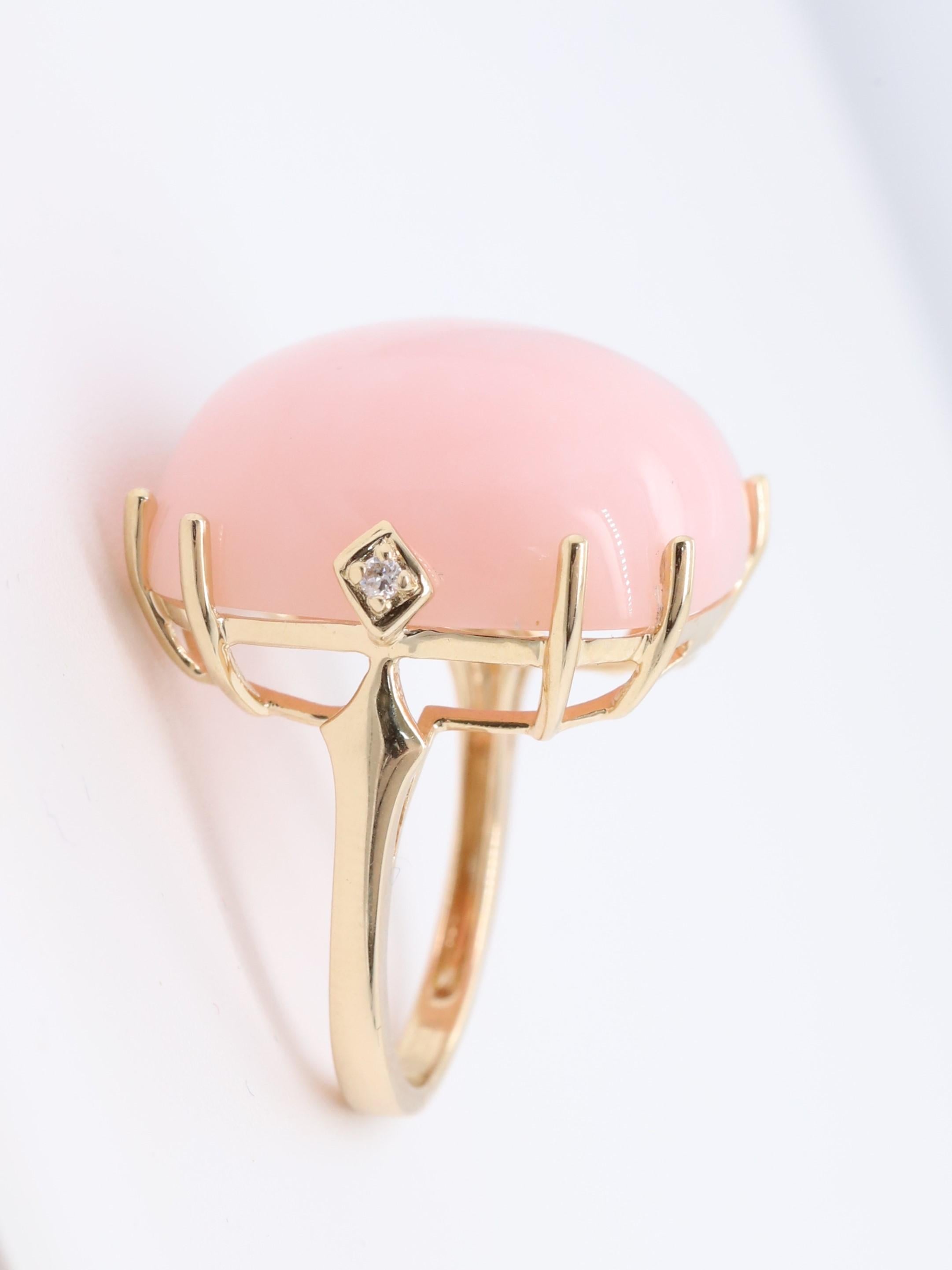 Decorate yourself in elegance with this Ring is crafted from 14-karat Yellow Gold by Gin & Grace. This Ring is made up of 19.0 mm Cushion-Cab (1 pcs) 21.57 carat Pink Opal and Round-cut White Diamond (2 Pcs) 0.03 Carat. This Ring is weight 3.09