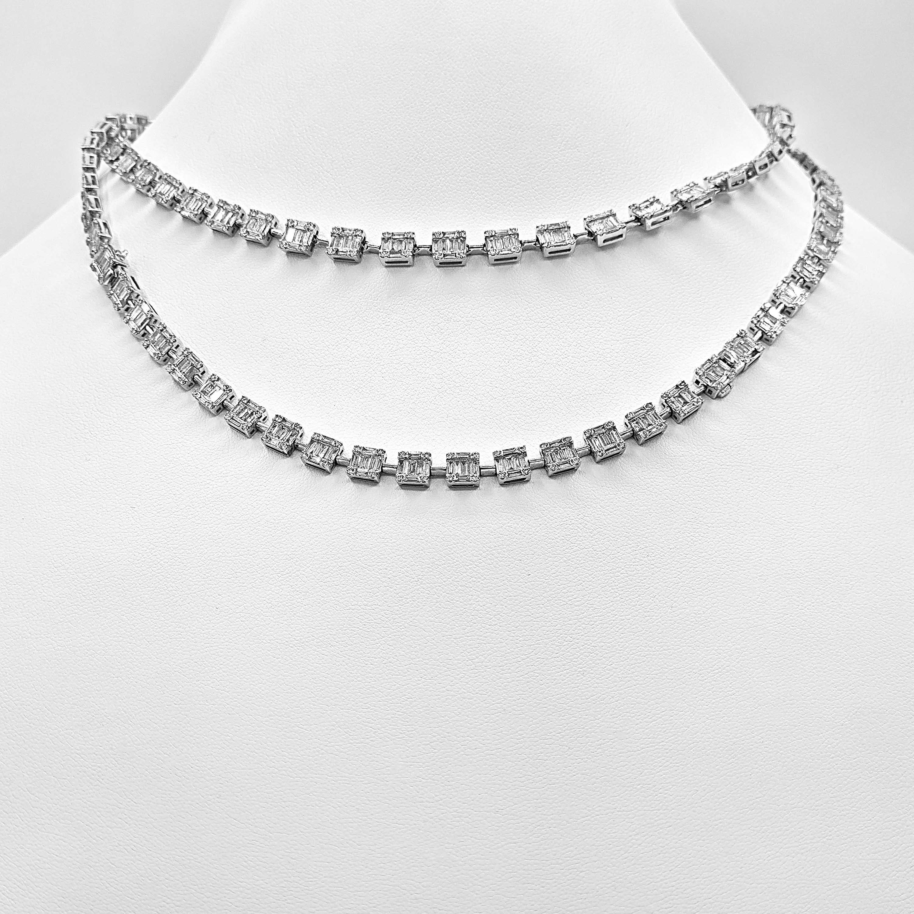 436 Round Diamonds:  3.6 Carats
706 Baguette Diamonds: 17.96 Carats
Metal: 18K White Gold, 53.98 Grams
