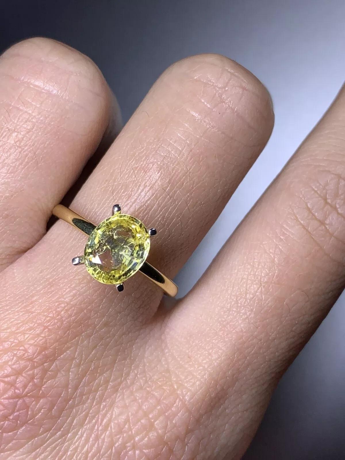 Oval Cut 2.15ct Yellow sapphire engagement ring in 18ct yellow gold. For Sale
