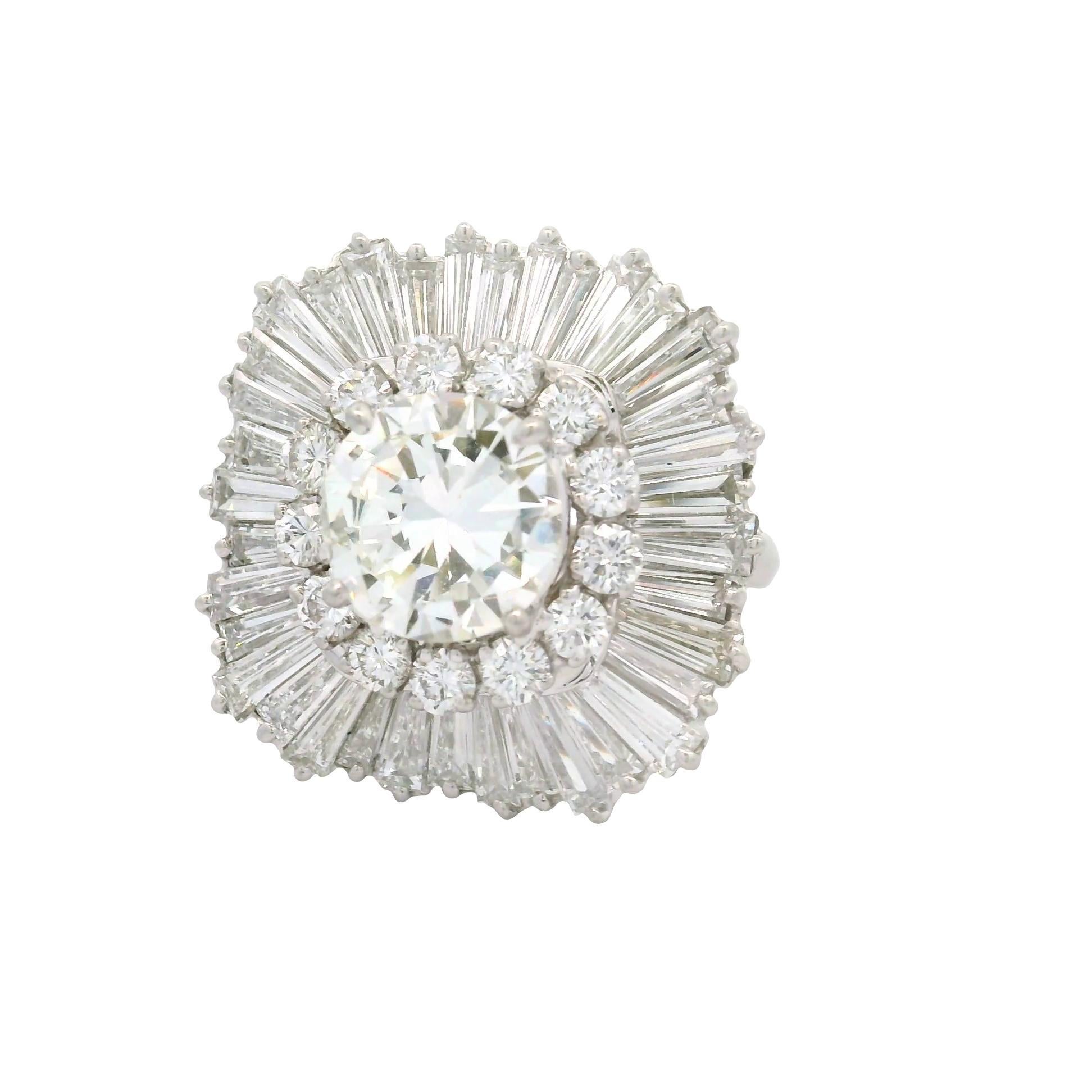 A dazzling cocktail ring featuring a central round brilliant-cut diamond, weighing 2.16 carats. The diamond is surrounded by a halo of round and baguette diamonds totaling approximately 4 carats. These stones create a radiant and sparkling effect