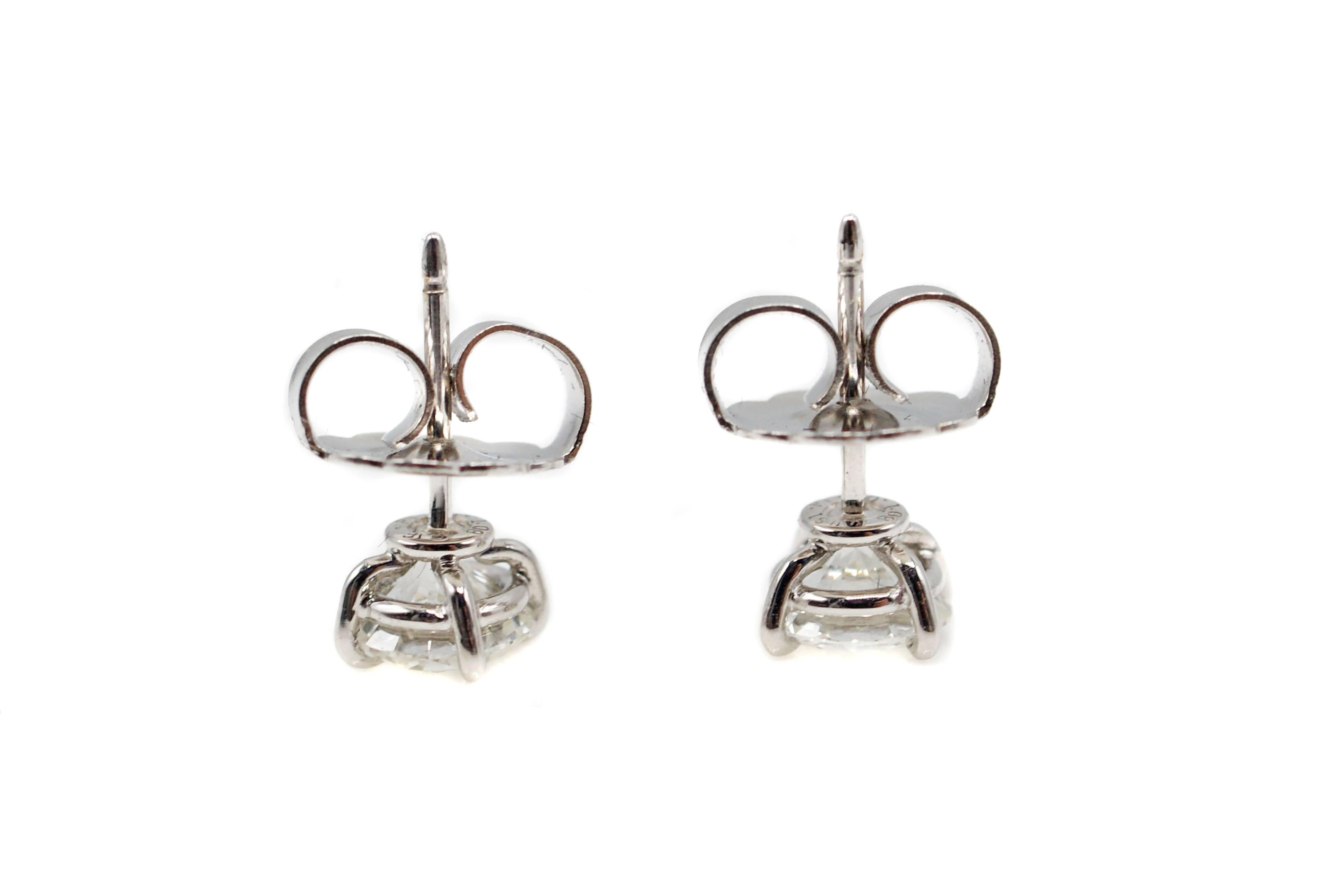 The perfect size and quality of diamond stud earrings is presented in these luxurious perfectly matched pair, set in 4 eagle-claw platinum prongs. The prongs are shaped to securely hold these valuable bright white and sparkly round brilliant cut