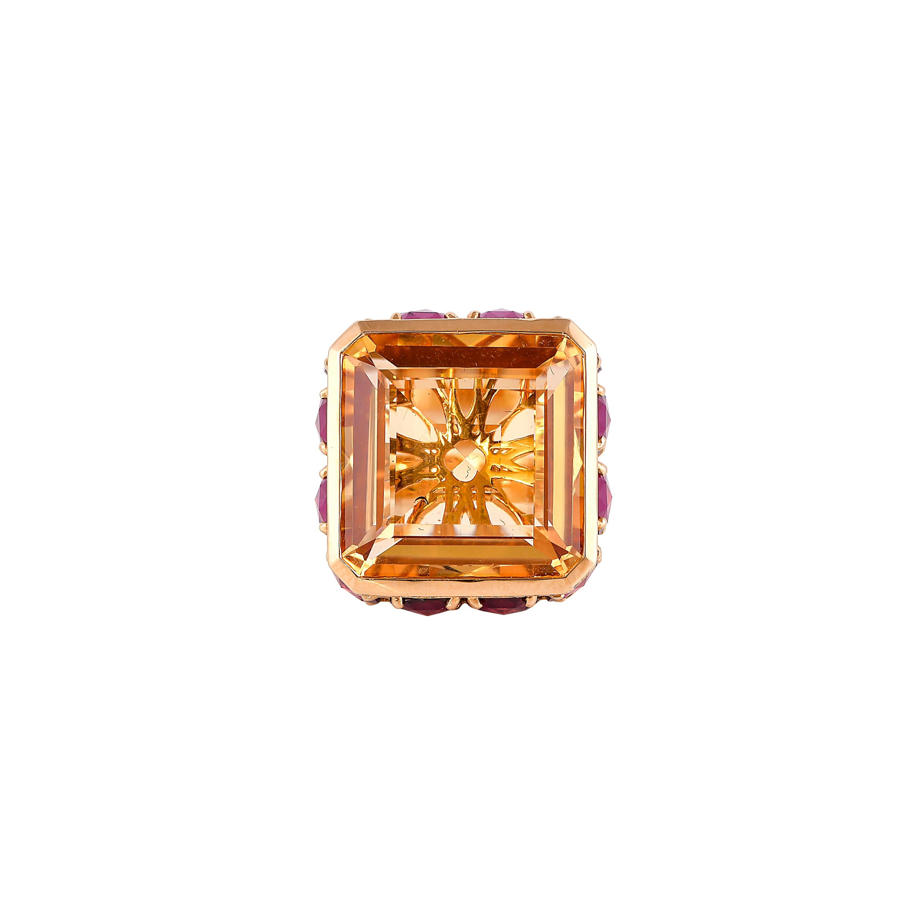 Sunita Nahata presents a stunning and regal 21 carat honey quartz cocktail ring. The stunning center stone vibrantly sits on top of a cluster of diamonds and radiant rhodolites. The unique architecture to construct and combine these gemstones makes