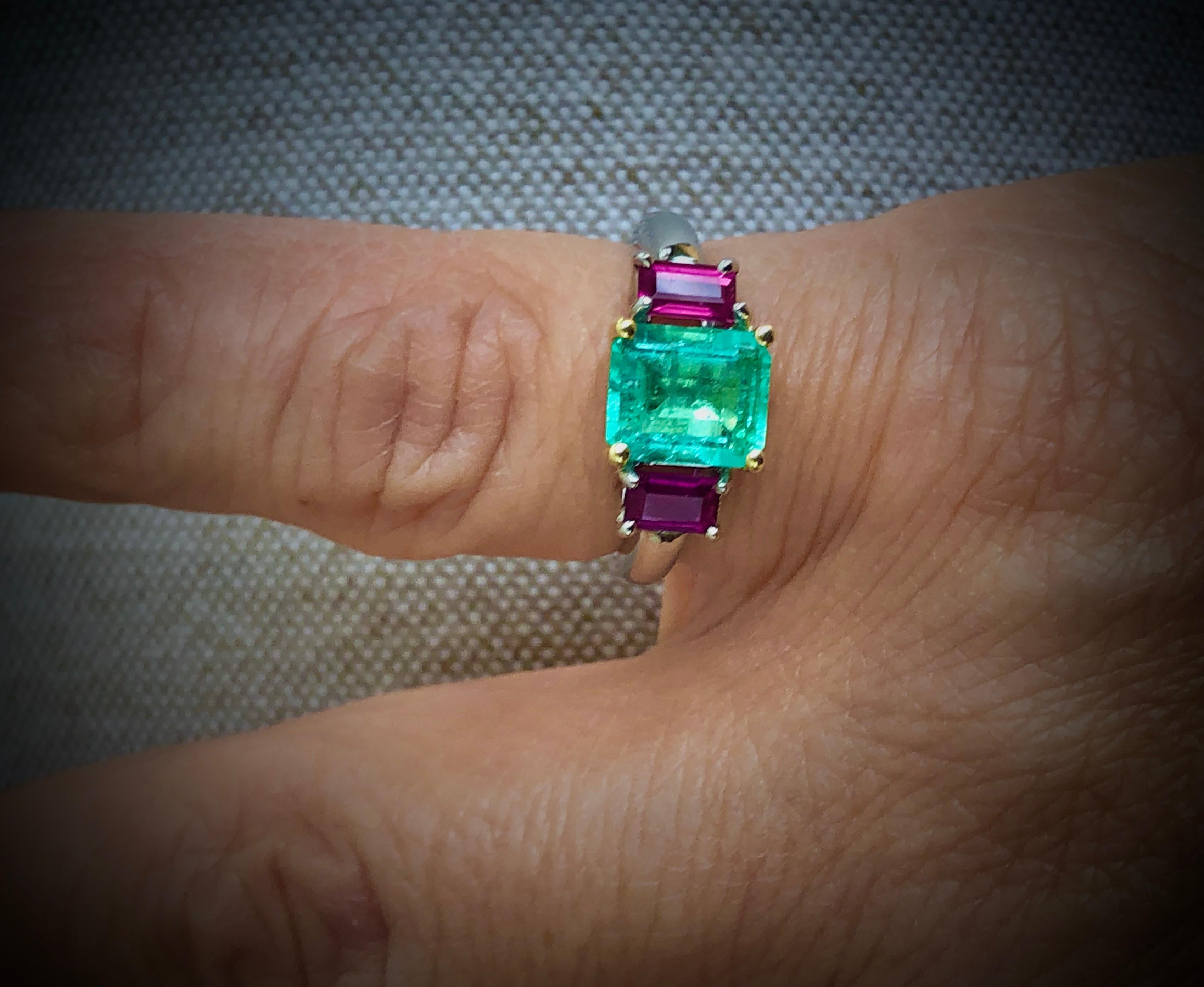 This classic trilogy ring stars a natural light medium green natural Colombian emerald, flanked by a matched pair of emerald cut natural rubies. Set in a timeless platinum and 18K gold. Very classic and easy for every day wear!
Primary Stone: