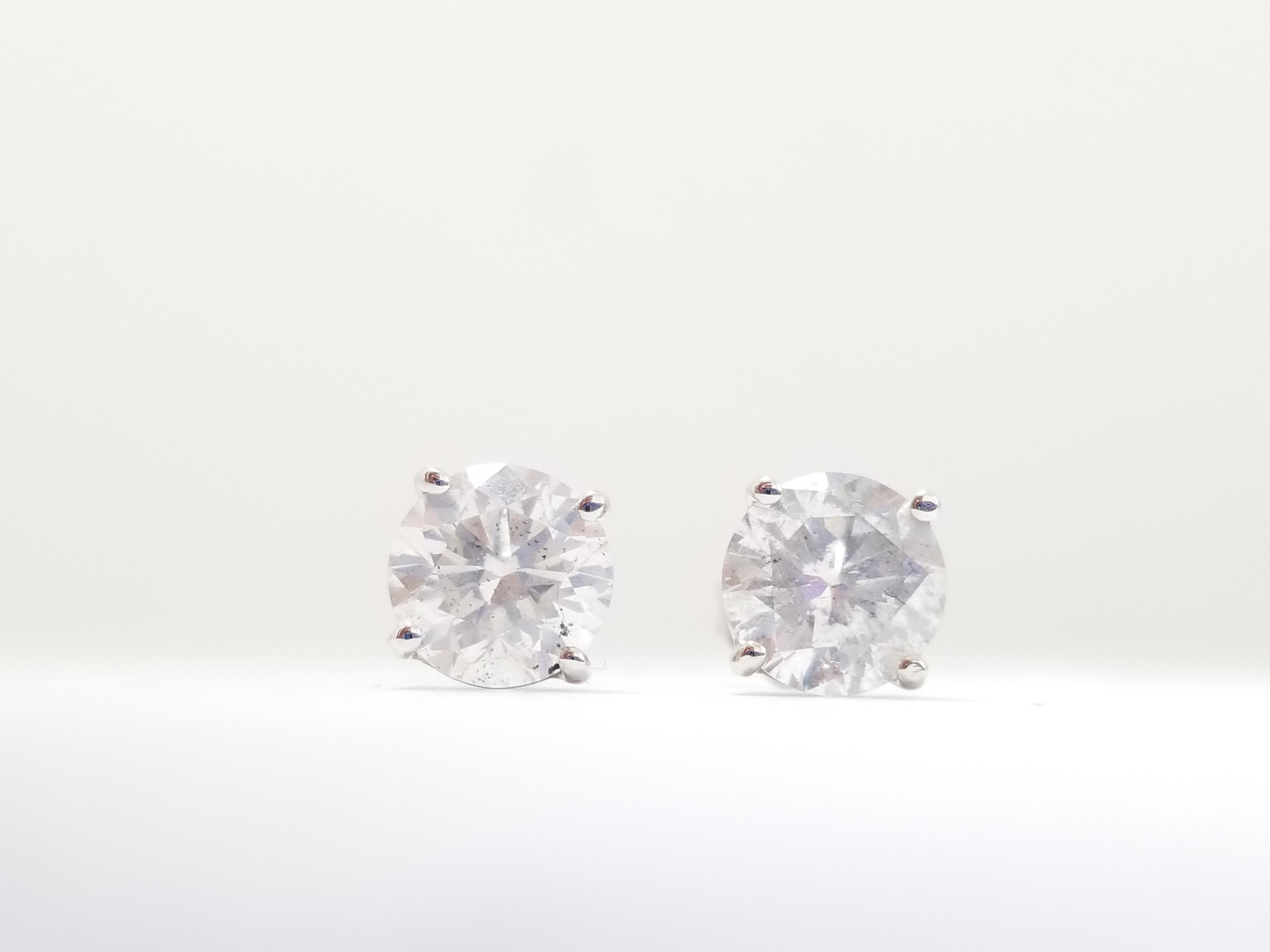 Natural Round Diamond Studs set in 4 prong push back 14k white gold GIA 1.08 Carat Diamond + GIA 1.08 Carat Diamond. 2.16 cttw.

GIA 1.08ct Color H Clarity I2 
GIA 1.08ct Color J Clarity I3