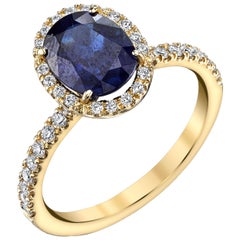 2.16 Carat Oval Blue Sapphire and .24 Carat Diamonds 18 Karat Yellow Gold Ring