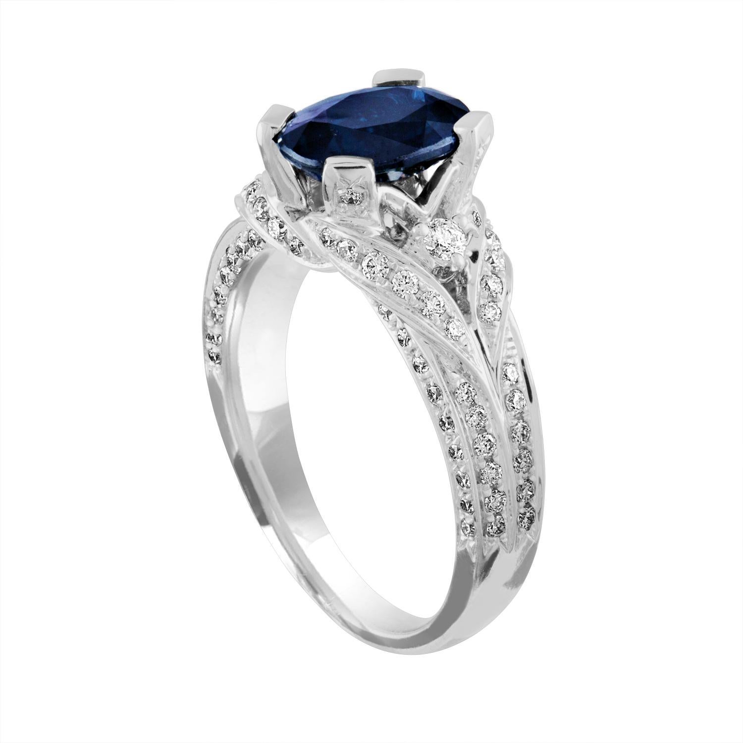 Beautiful Blue Sapphire Ring.
The ring is 18K White Gold.
The Blue Sapphire is Oval 2.16 Carat.
The stone is Heated.
There are 0.75 Carat Diamonds F/G VS/SI.
The ring is a size 6.75, sizable.
The ring weighs 6.3 grams