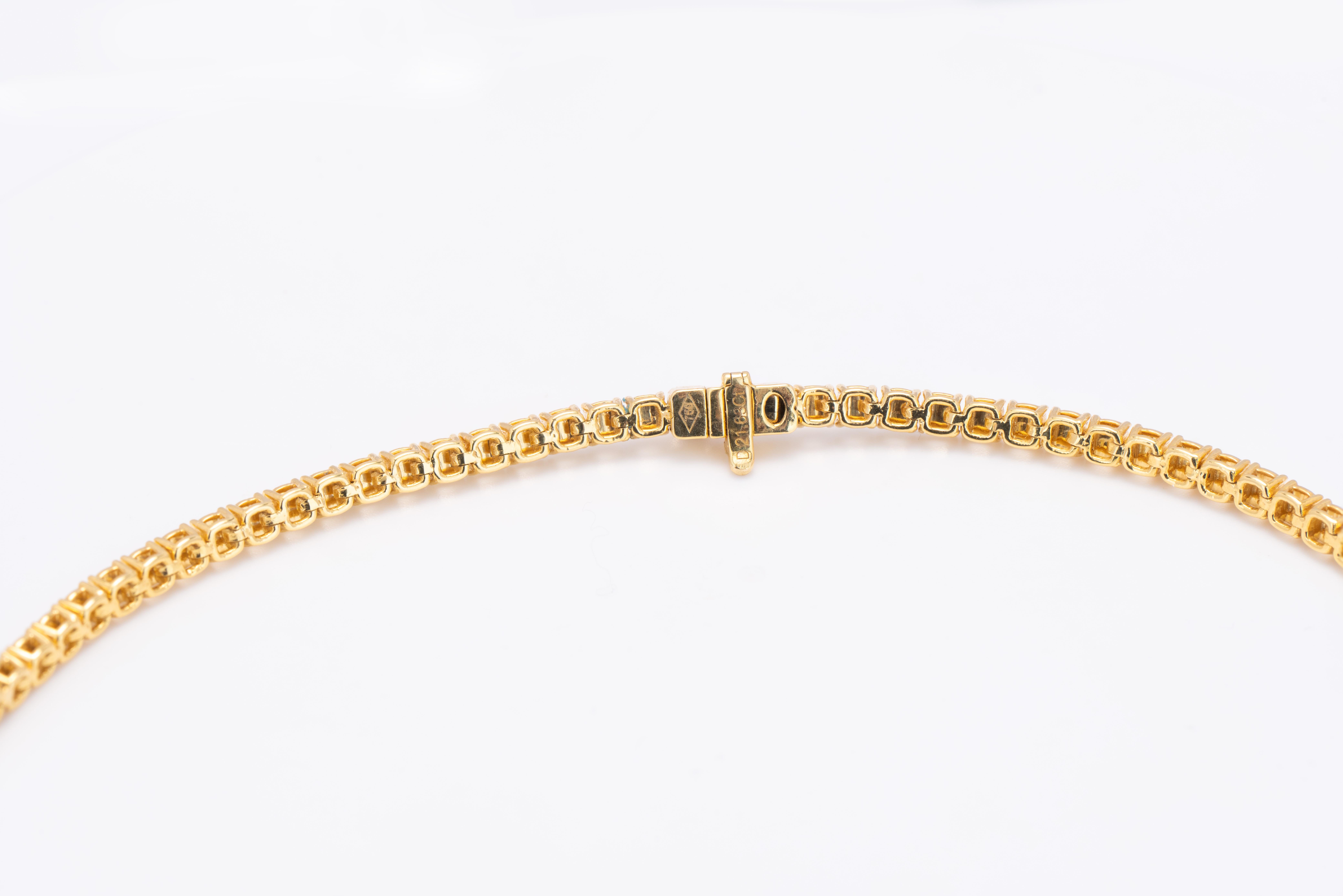 Elevate your neckline with this gorgeous 18kt yellow gold necklace adorned with natural yellow diamond cushion-cut. The piece effortlessly captures the essence of refined elegance, making it a cherished accessory for any occasion.

Certified by