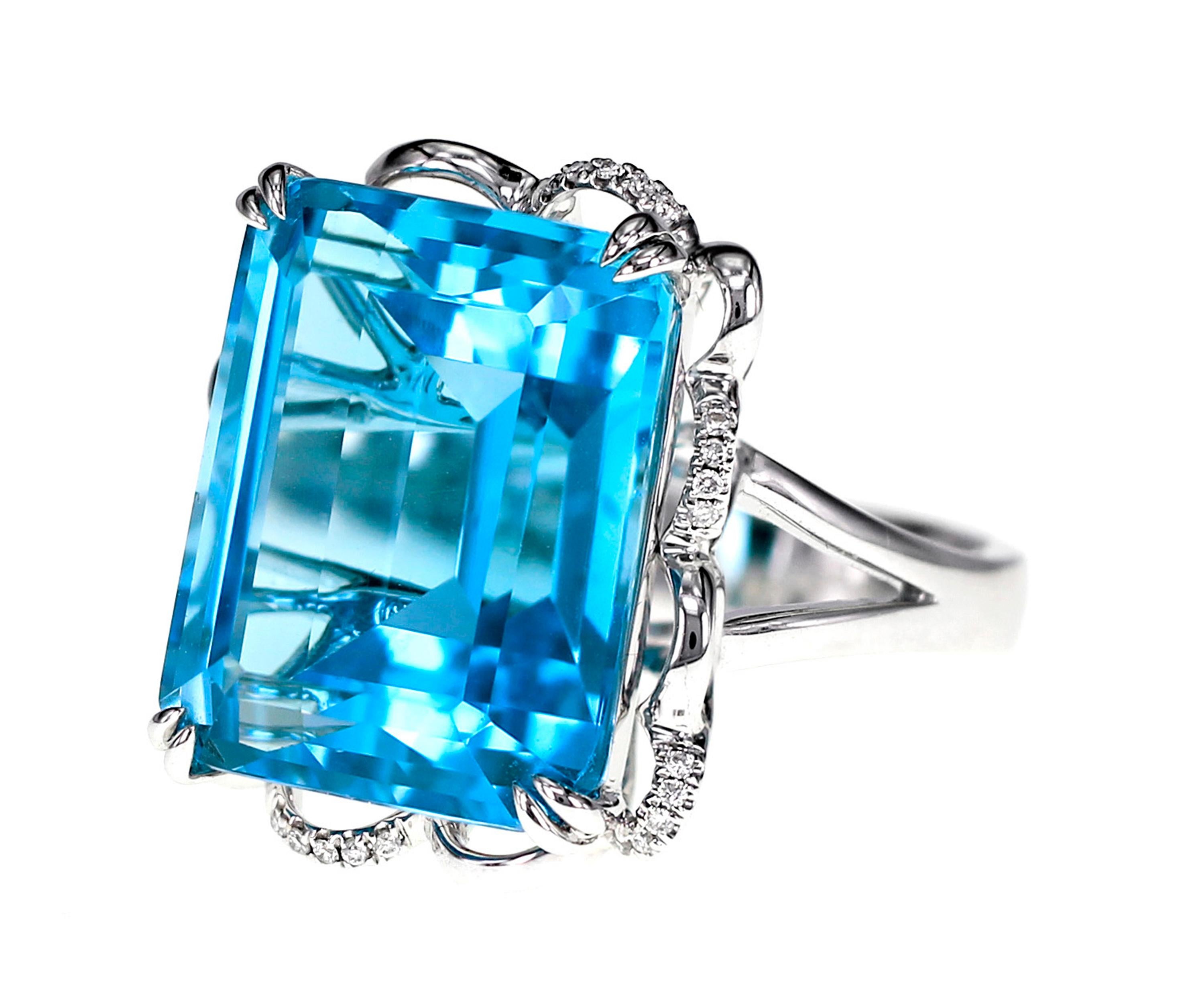 A lovely London Blue 21.64 carat of Blue Topaz is set with FG color Vs clarity white brilliant round diamond. The ring is made in white gold and 18 Karat. A total of 4.33 grams of gold has been used to make this classic ring.
Ring size : US 6