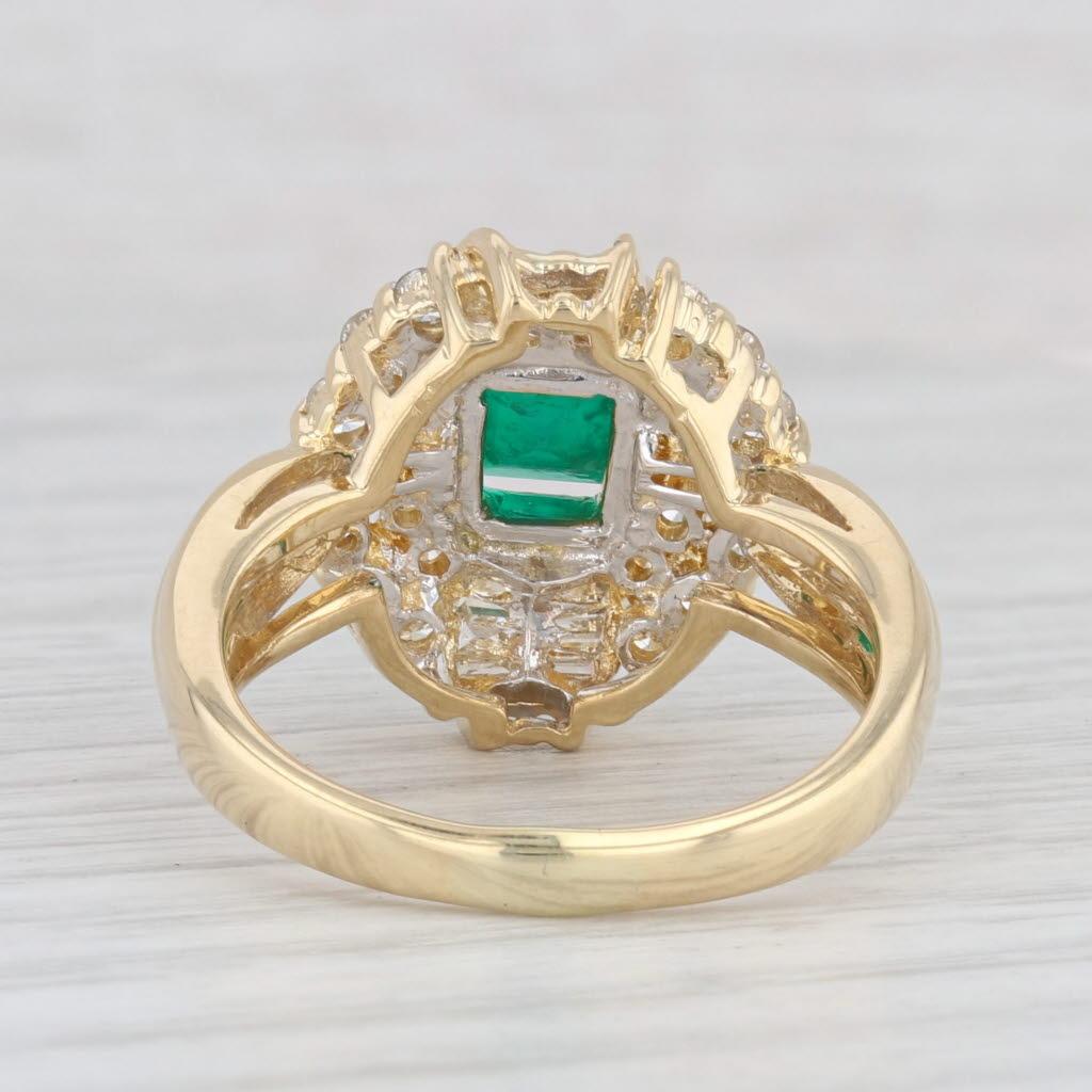 Gemstone Information:
- Natural Emerald -
Carats - 1.16ct 
Cut - Emerald
Color - Green
Treatment - Oiling

- Natural Diamonds -
Total Carats - 0.56ctw
Cut - Round Brilliant
Color - G - H
Clarity - VS2 - SI1

Metal: 18k Yellow Gold
Weight: 8.9 Grams