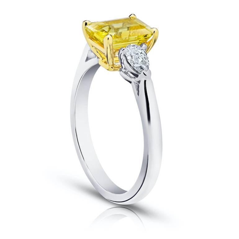 2.17 carat emerald cut yellow sapphire with pear shape diamonds .38 carats set in a platinum and 18k yellow gold ring.
