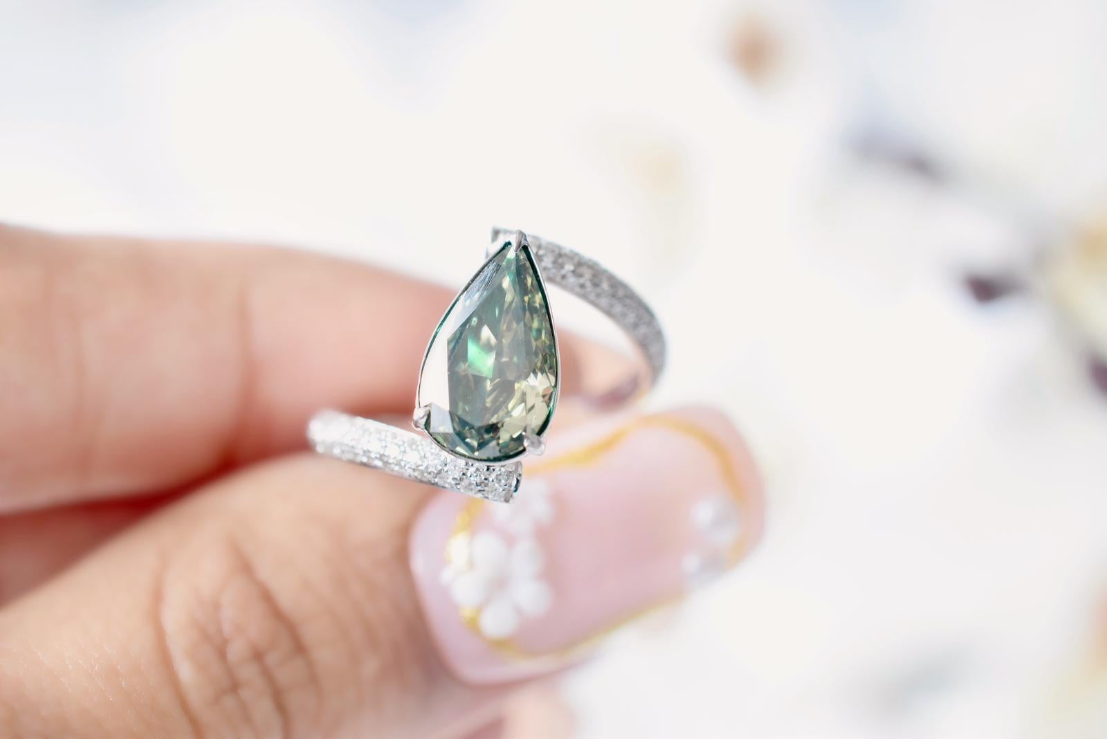 **100% NATURAL FANCY COLOUR DIAMOND JEWELLERY**

✪ Jewellery Details ✪

♦ MAIN STONE DETAILS

➛ Stone Shape: Pear
➛ Stone Color: Fancy Dark Gray Yellowish Green
➛ Stone Weight: 2.17 carats
➛ GIA certified

♦ SIDE STONE DETAILS

➛ Side white diamonds