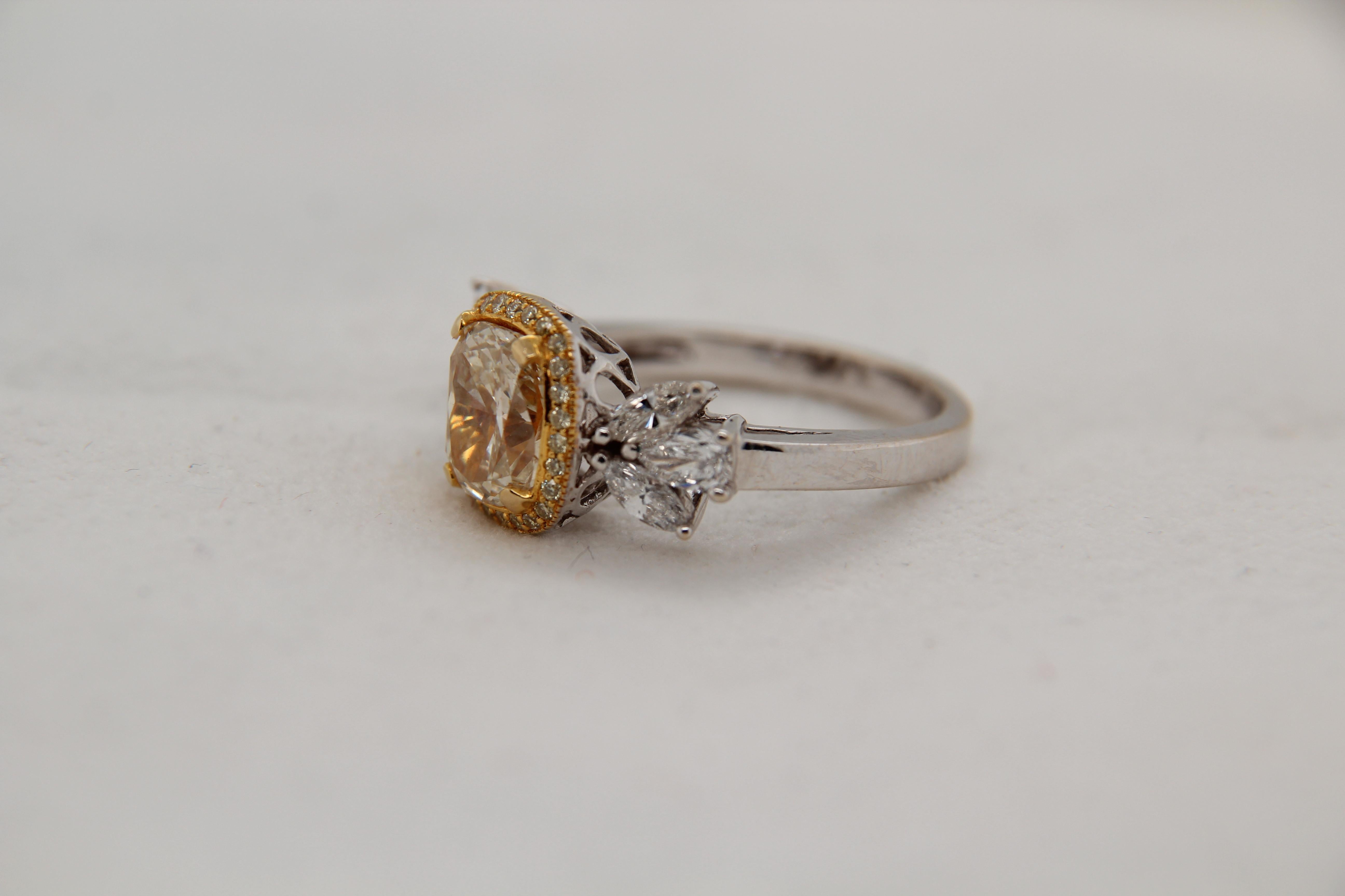 A brand new 2.17 carat fancy yellow diamond ring in 18 karat gold. The centre diamond weigh 2.17 carat and total diamond weight 3.09 carat. The total weight of ring is 6.53 grams.
