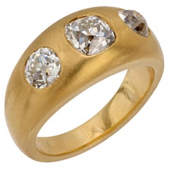 2.17 carat old mine cut diamond matte 18k gold three stone band