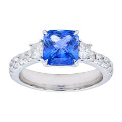 2.17 Carat Radiant Cut Blue Sapphire Ring with Trapezoids and Diamond Band