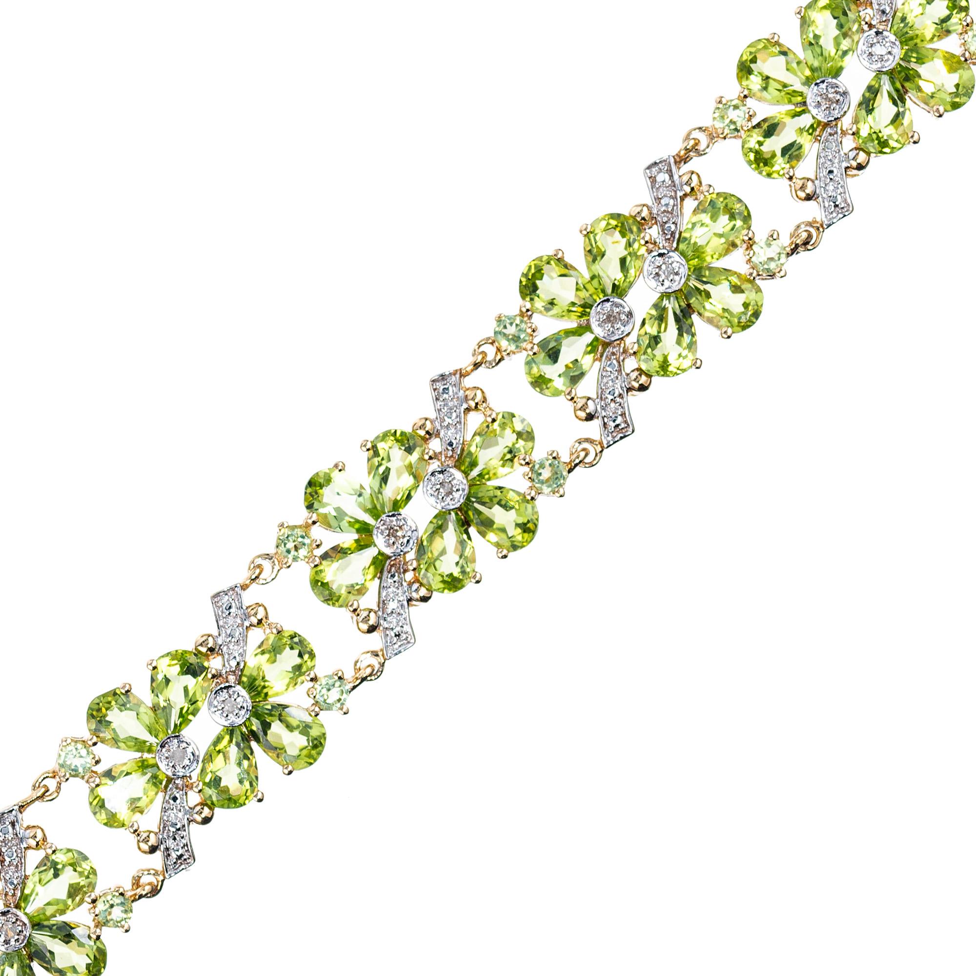 21.75 carat peridot flower bracelet with diamond accents. This bracelet is adorned with 54 pear shaped green peridots totaling 21.00cts. 18 round green peridots totaling .75cts and accented by 18 round diamonds. 7.5 inches in length. Built in catch