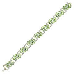 Bracelet fleur en or jaune 21,75 carats péridot diamant 