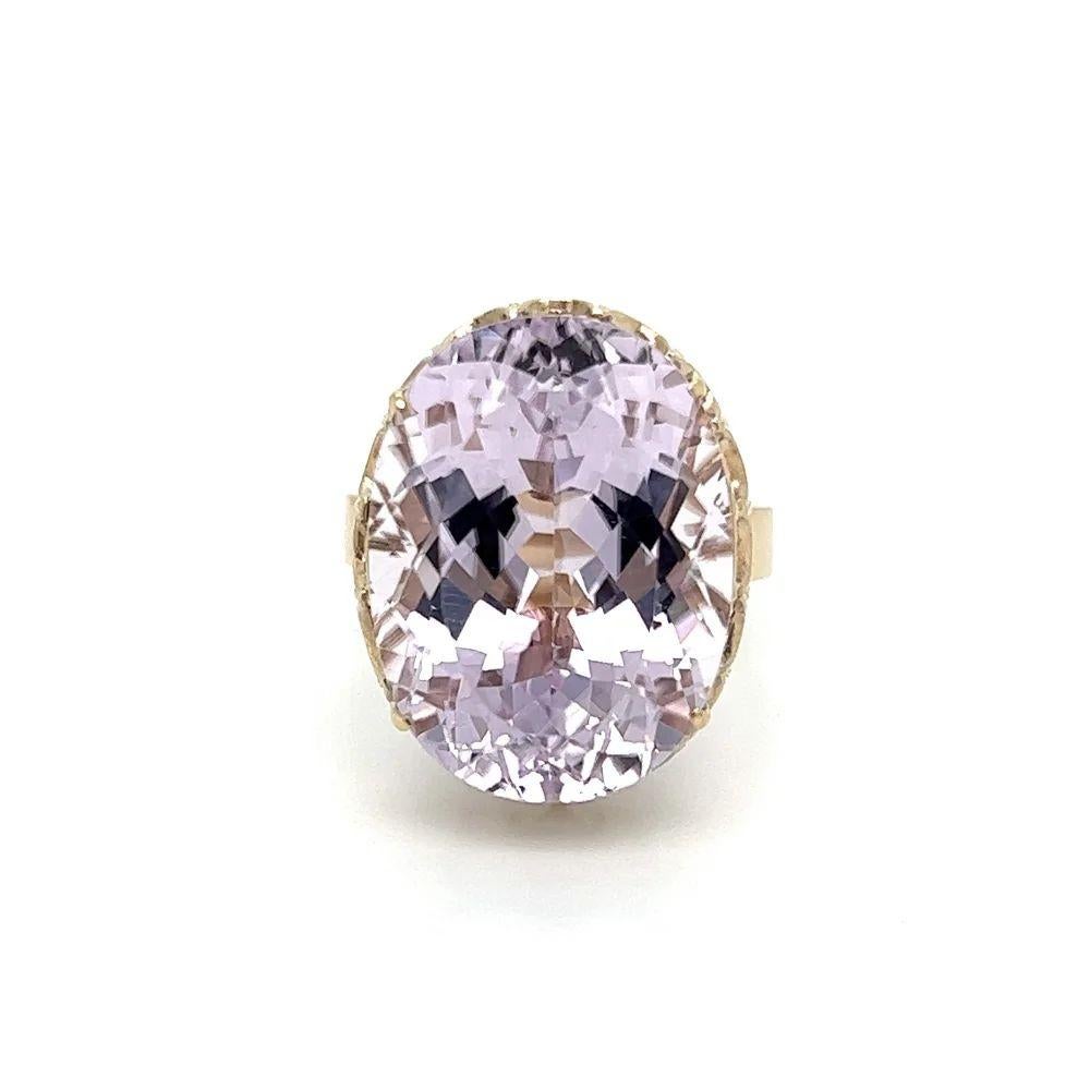 Simply Beautiful! Large Oval Kunzite Solitaire Gold Cocktail Ring. Centering a Hand set securely nestled Oval Kunzite, weighing approx. 21.77 Carats. Hand crafted 14K Yellow Gold mounting. In excellent condition and recently professionally cleaned