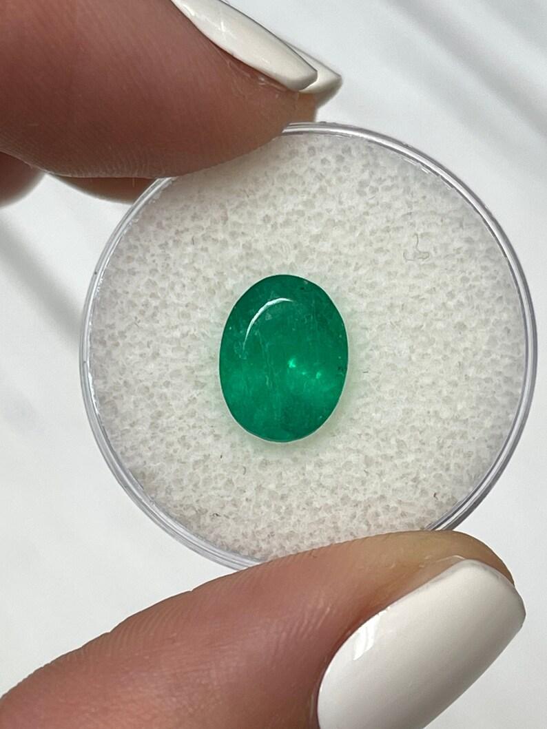 Modern 2.18 Carat 10.4x8.1 Rich Muzo Green Colombian Emerald - Oval Cut May Gem For Sale